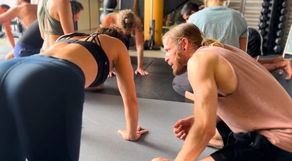 Functional Patterns practitioner guiding a client through biomechanical training for hunchback posture treatment