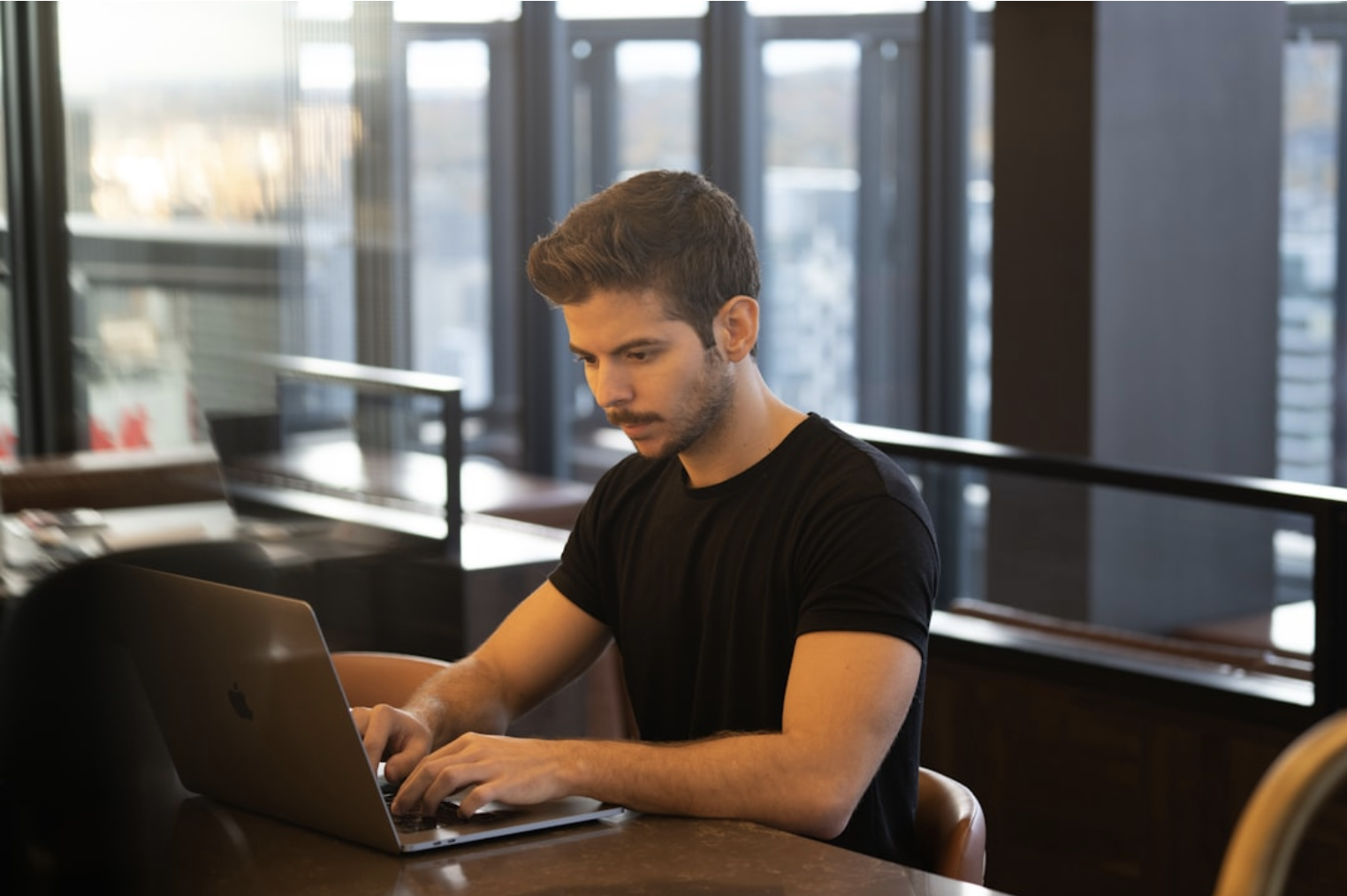 Graphic depicting common causes of hunchback posture including poor posture habits and sedentary lifestyle