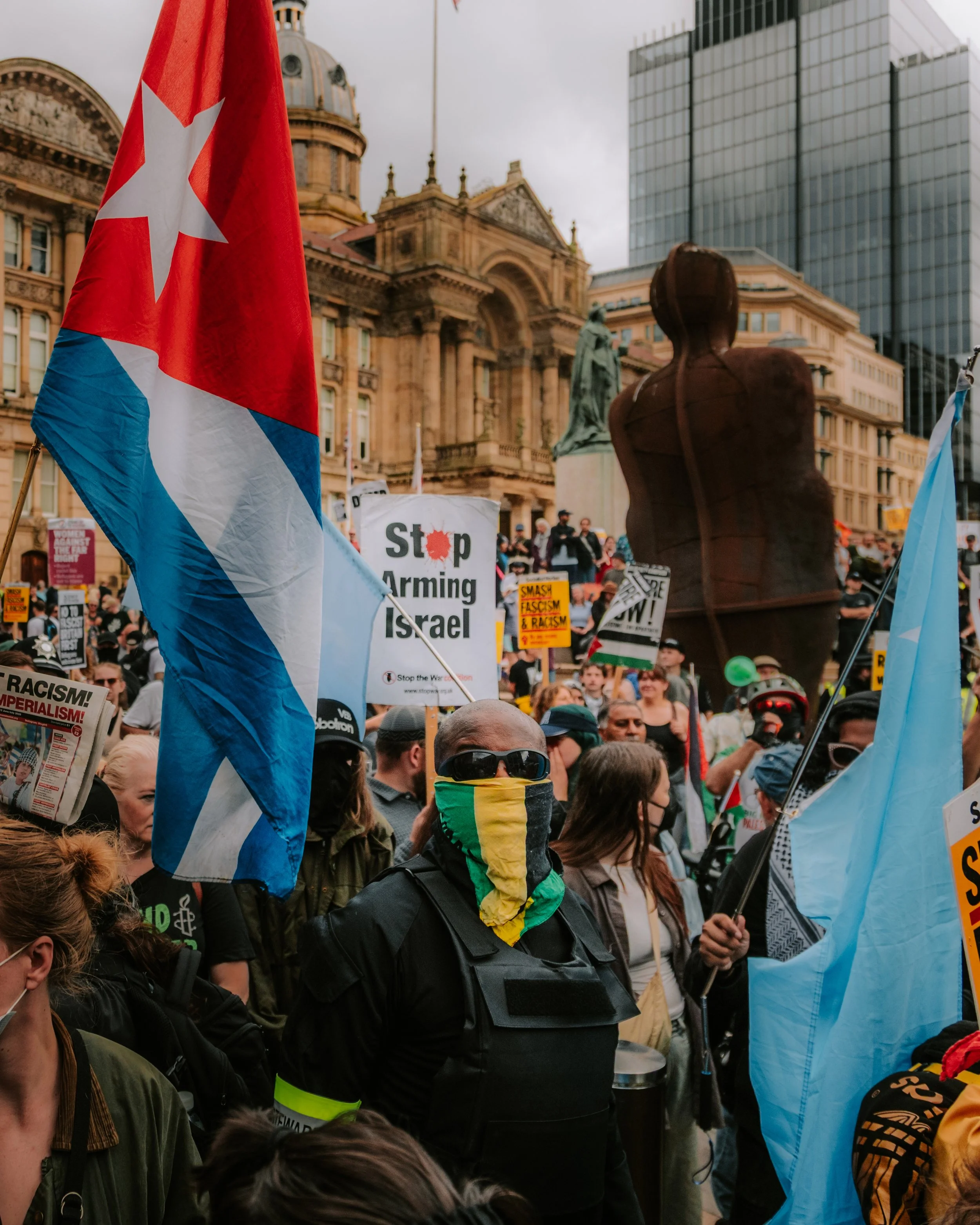 Anti-racist and anti-fascist protesters assemble in Birmingham Victoria Square to counter protest a Britain First march. 