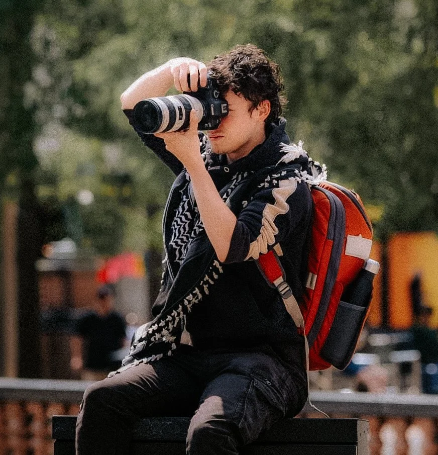 Troy Walker taking photos at a Palestine Protest
