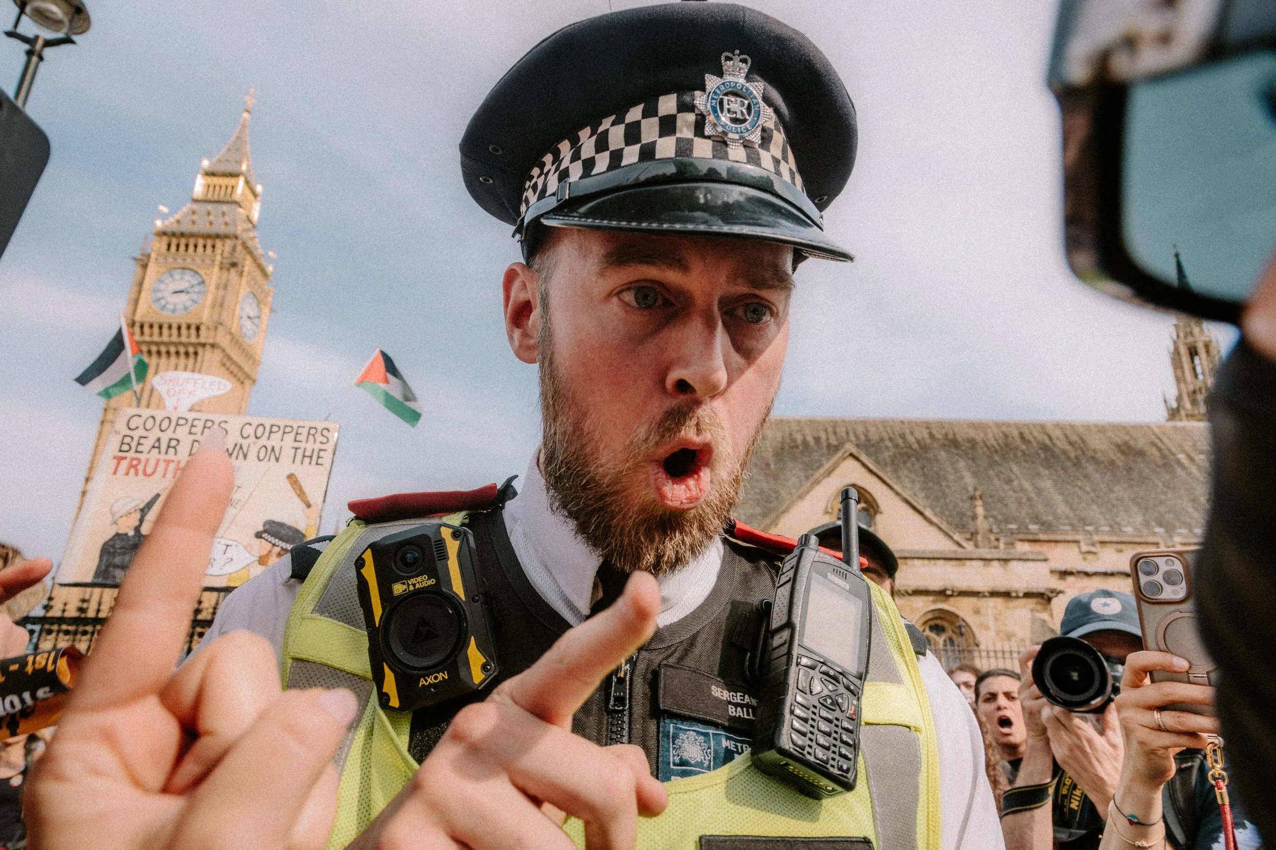 Police officer shouting at protesters during a Defend Our juries demonstration against the proscription of Palestine Action. The protest took place in Parliament Square on the 6th September 2025. Over 1000 people were arrested holding signs. 