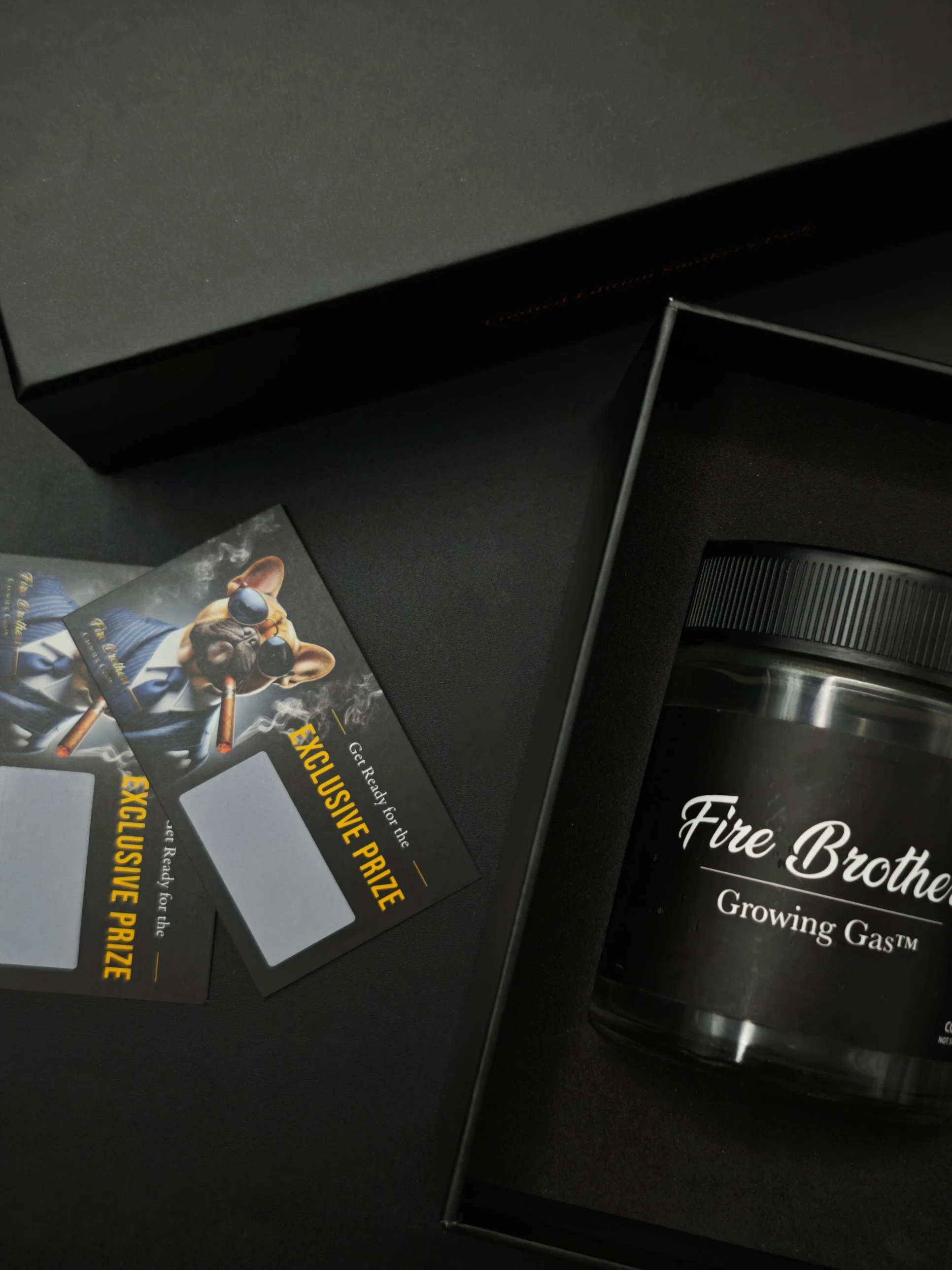 Gold foil hot-stamped logo on a black rigid box lid for cannabis packaging