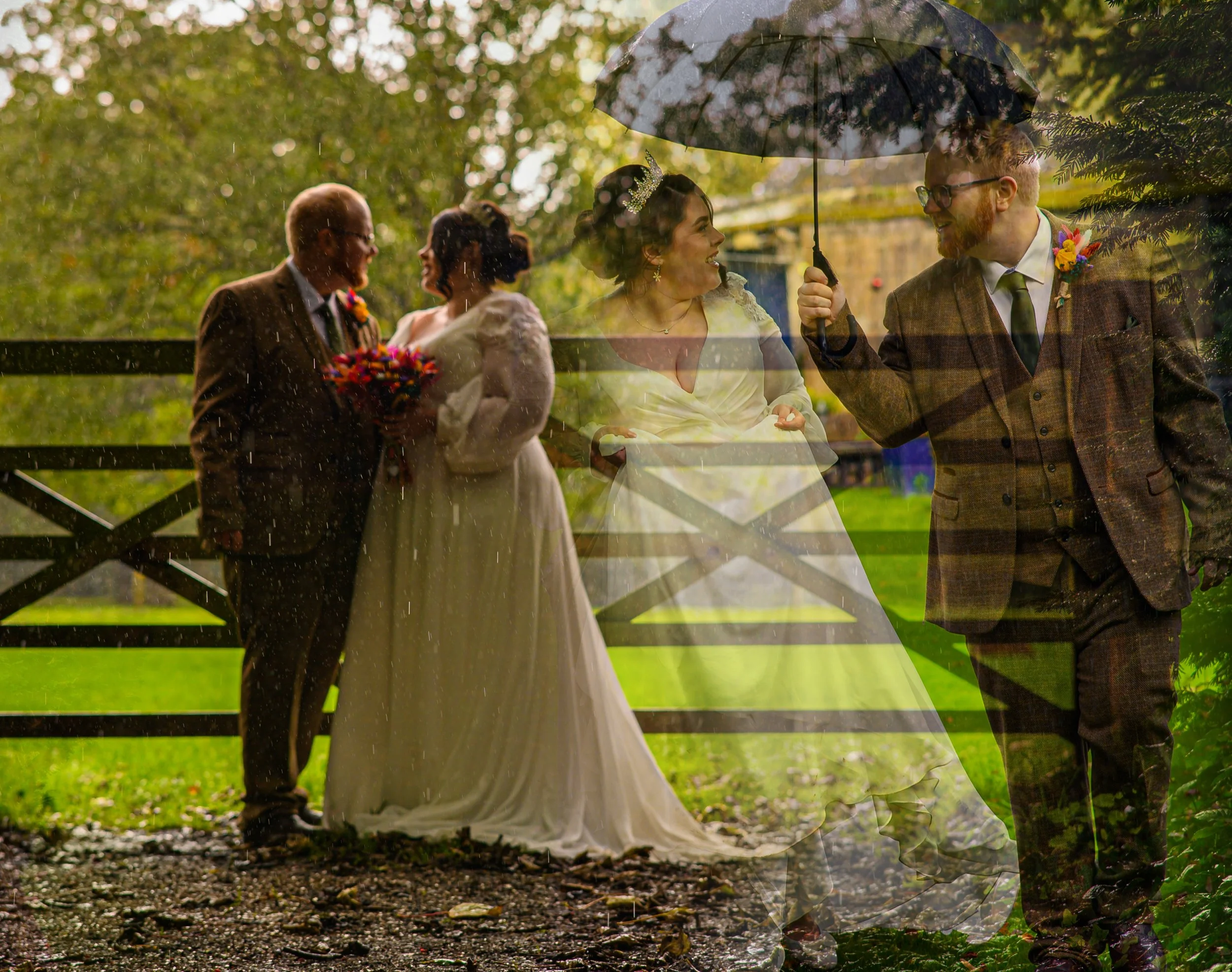 Bride na groom on their wedding day standing and giggling in the rain and smiling at each other under an umbrella. Brightly coloured wedding florals and bouquet.