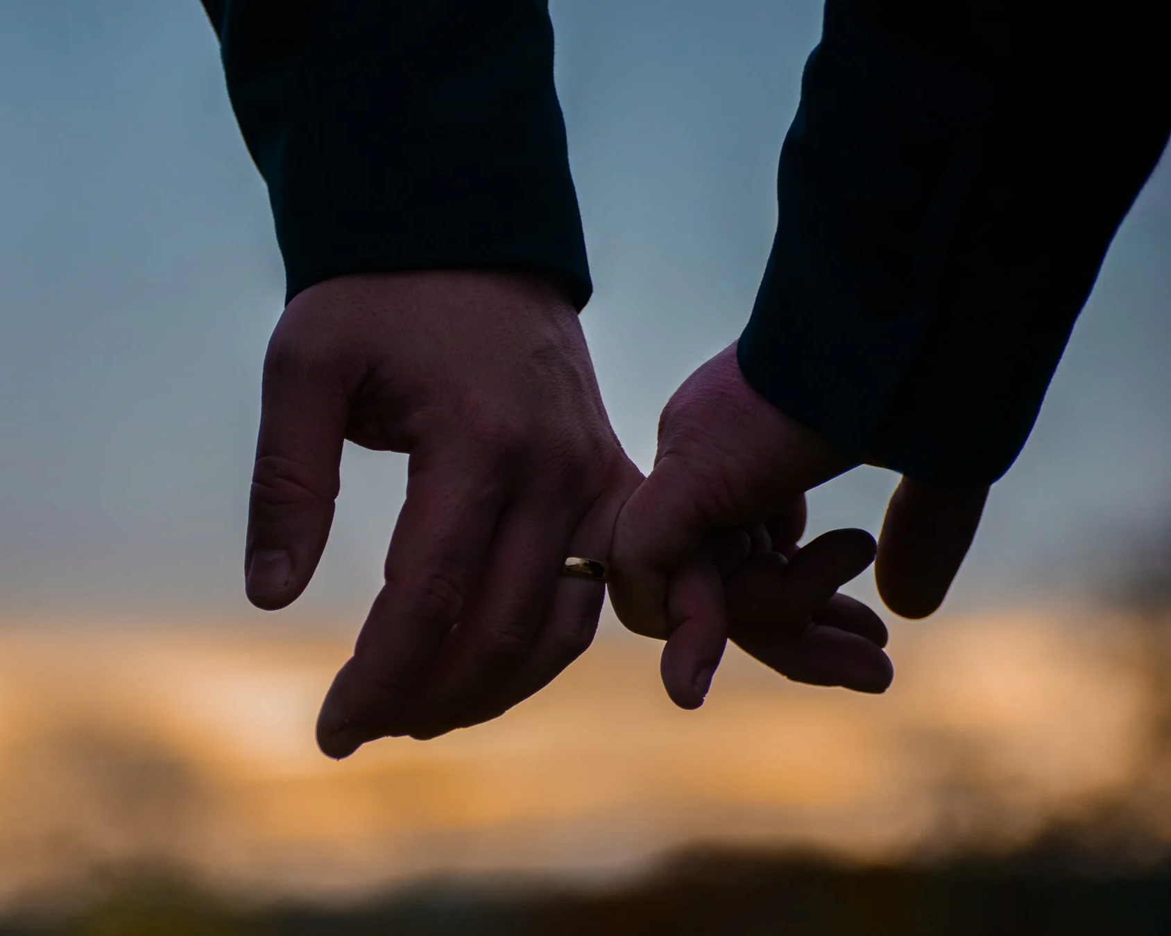 two groom holding hands on their wedding day - natural and relaxed wedding photography