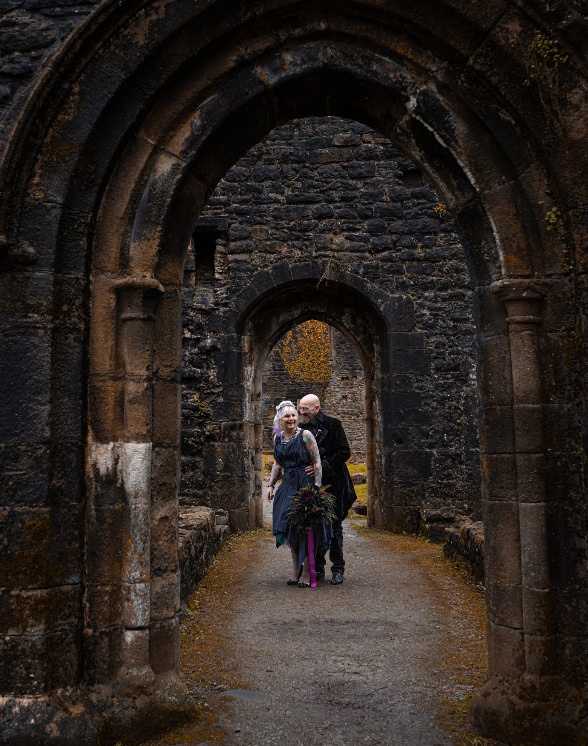 gothic couple on a post wedding photography shoot - whalley abbey ruins - Lancashire - medieval romance - gothic architecture