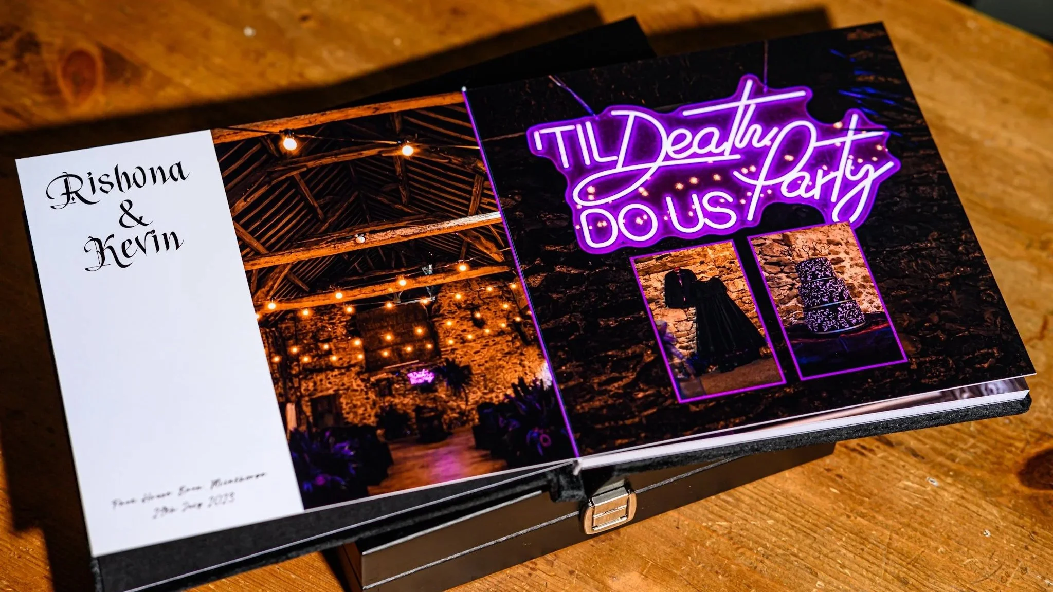 Title page of a wedding photo album. A dark and dramatic ceremony room, couple name and wedding location, neon sign of 'Til death do us party', couples attire hung up and their cake. This first page sets up the story book of images