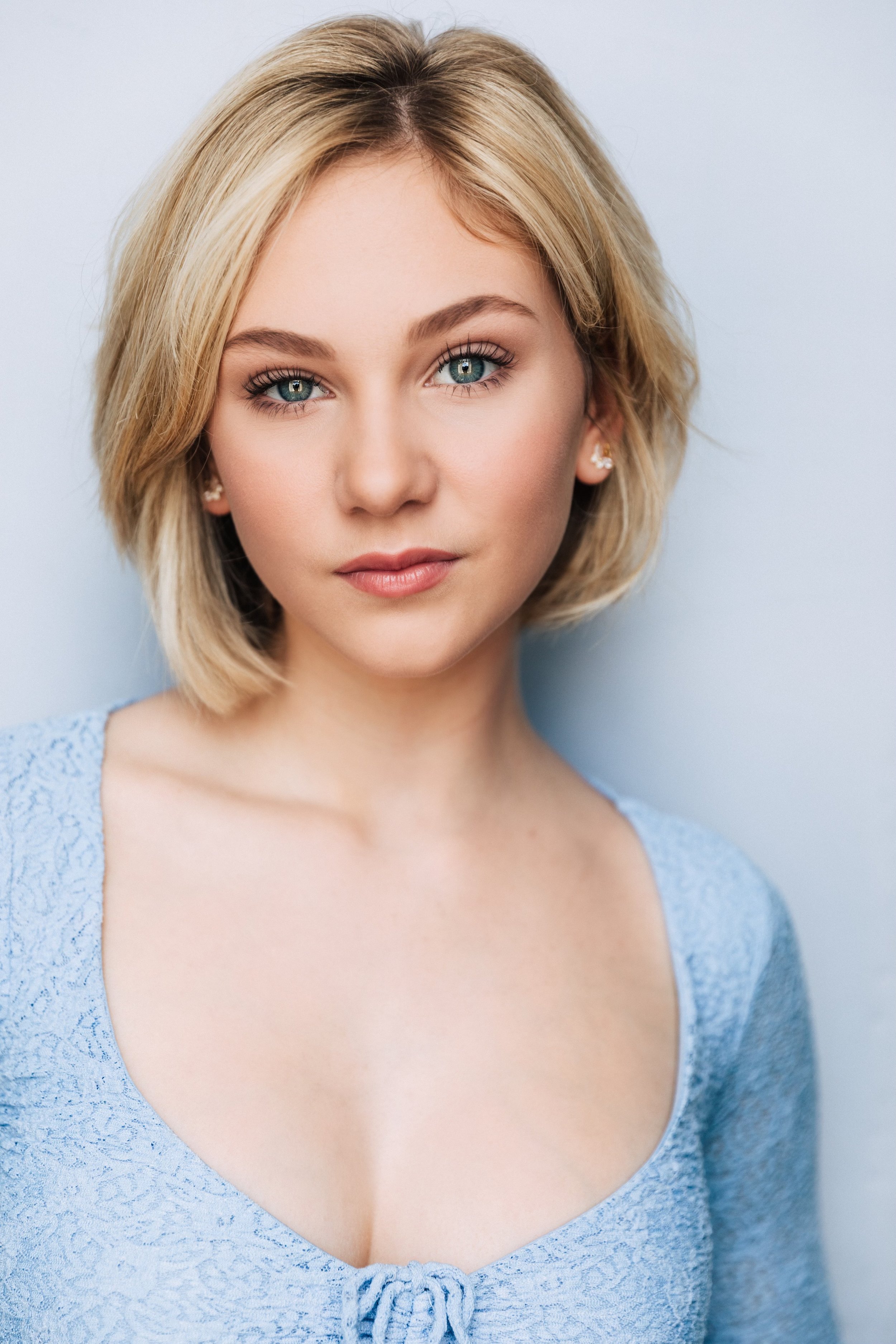 Light blue top headshot 2.jpg