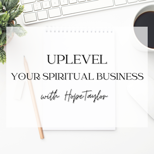 Uplevel your spiritual business coffee cup next to keyboard and pencil.