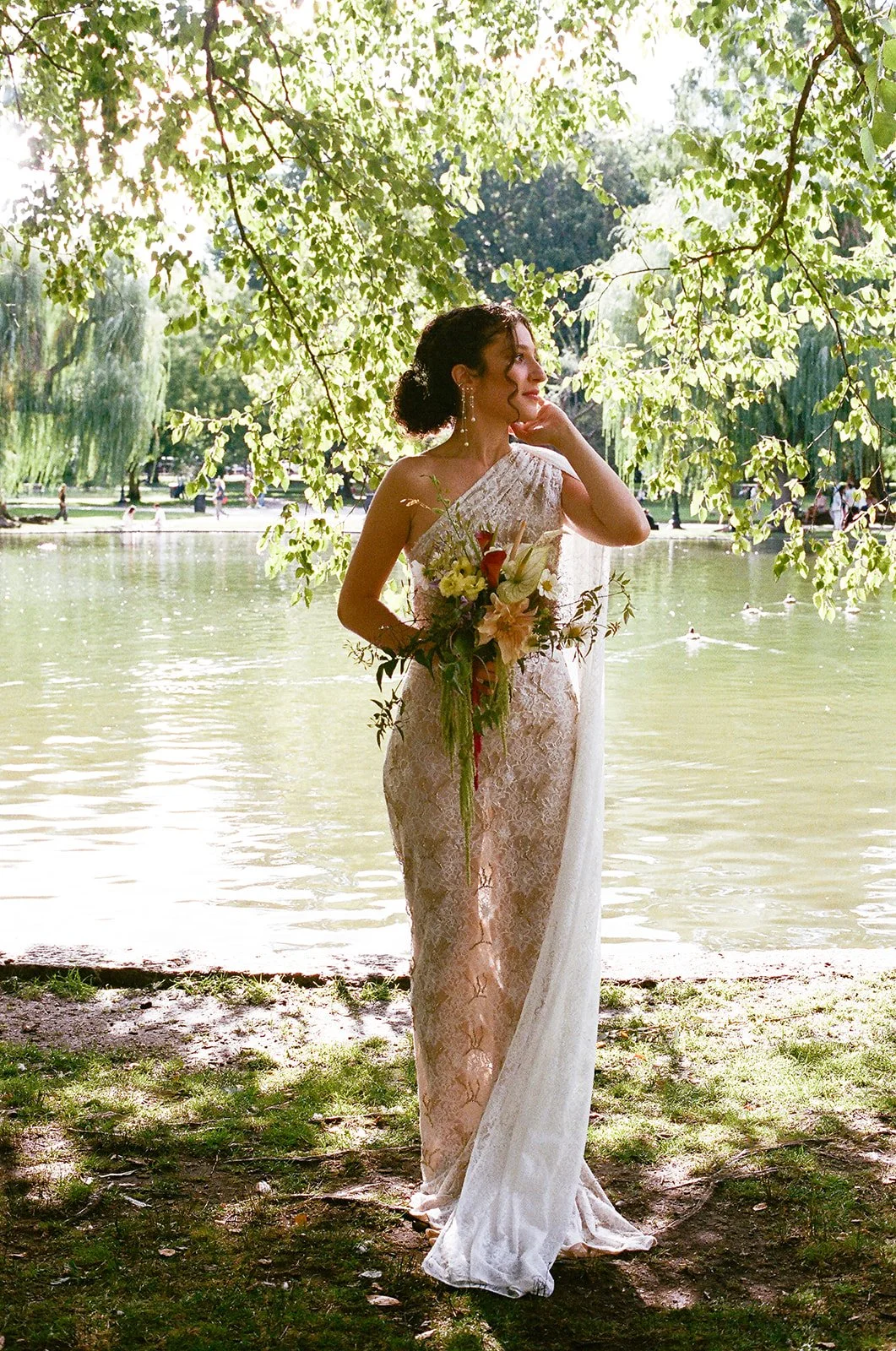 Bride at Boston Public Garden holding an amaranthus wedding bouquet