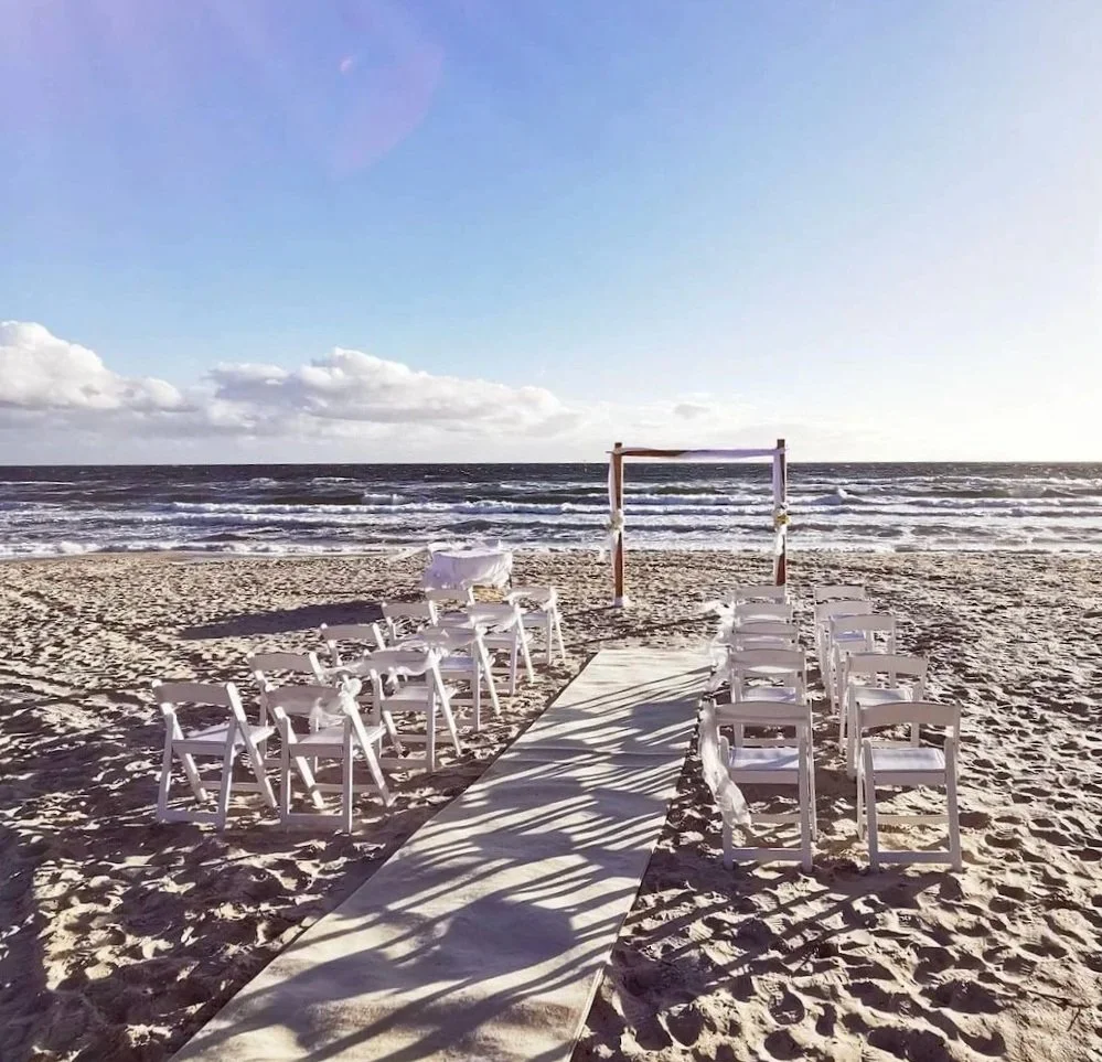 Wedding set up on a beach in Melbourne for an elopement with 20 guests