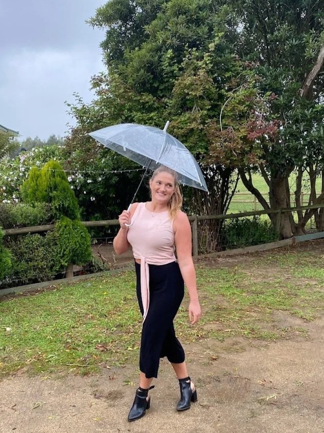 Melbourne marriage celebrant Kayleigh officiating a ceremony on a family farm in Gippsland
