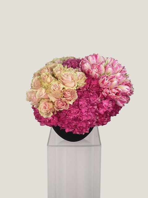 Collection of pinks has it all, hot pink hydrangea, medium to light pink tulips and stunning Pink Mondial roses. 