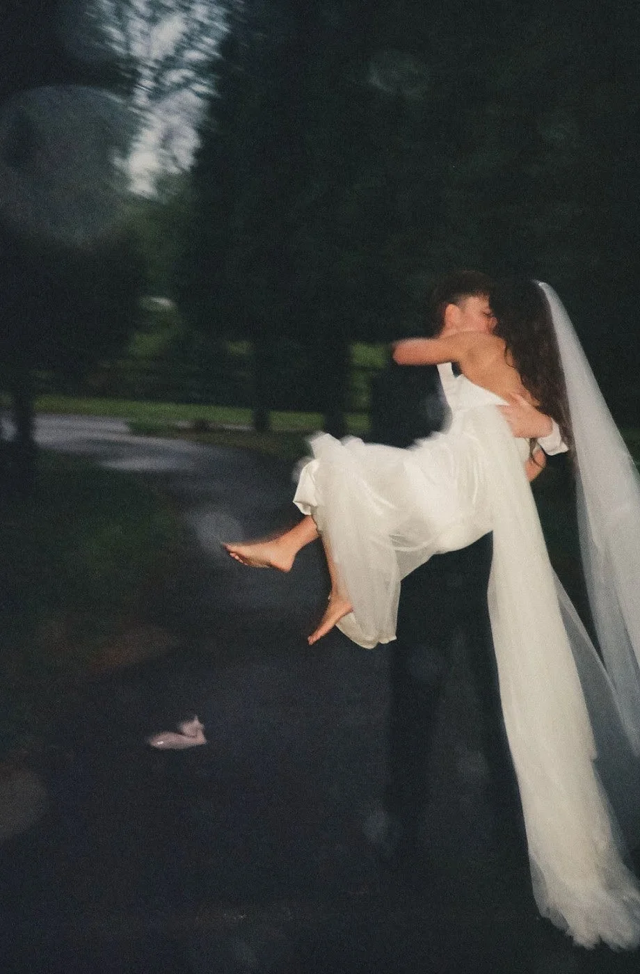Groom lifting his bride during an evening portrait at The Eden Estate. Photo by Jenna York.