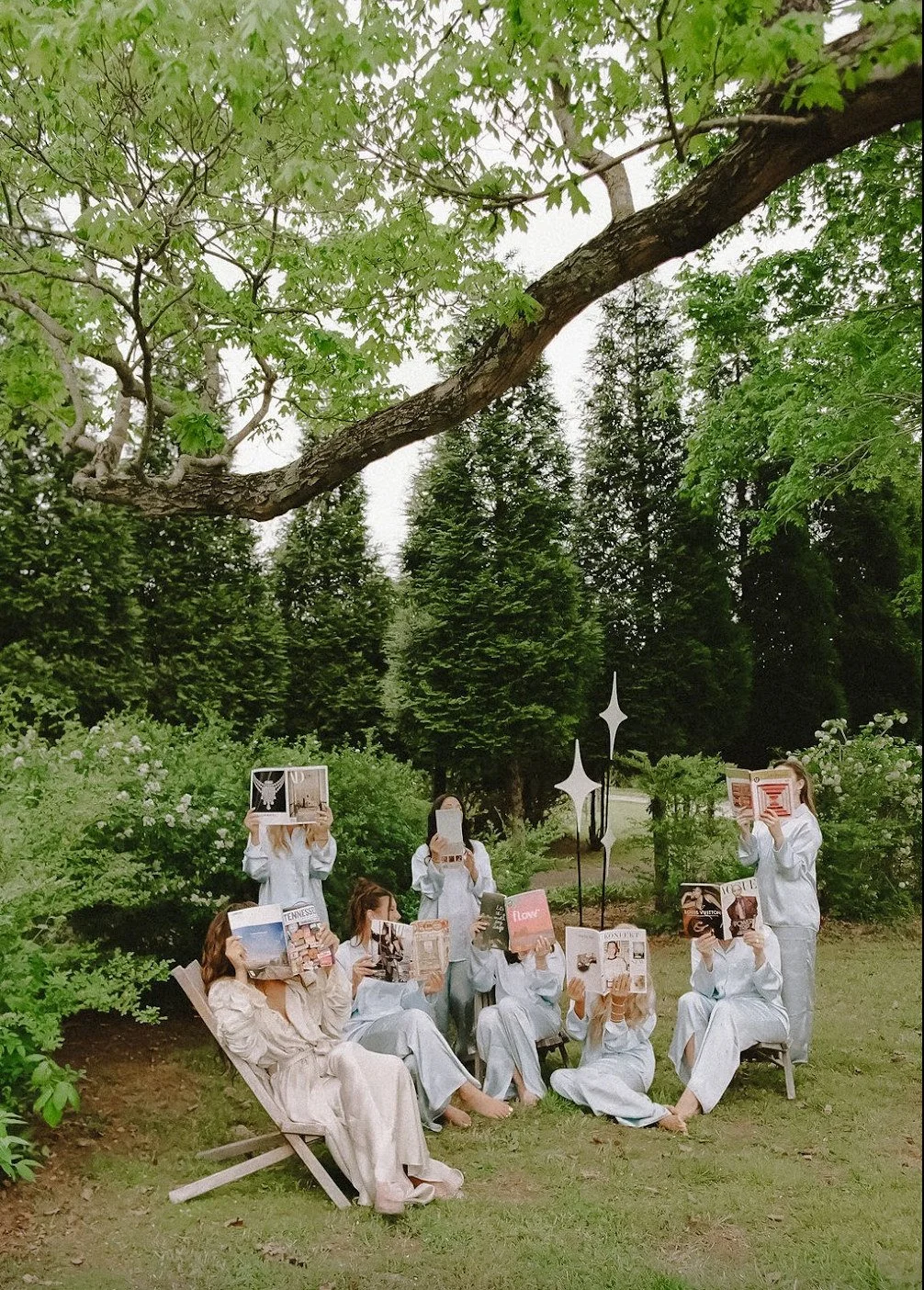 Bridal party celebrating beneath the trees at The Eden Estate near Nashville. Photo by Jenna York.