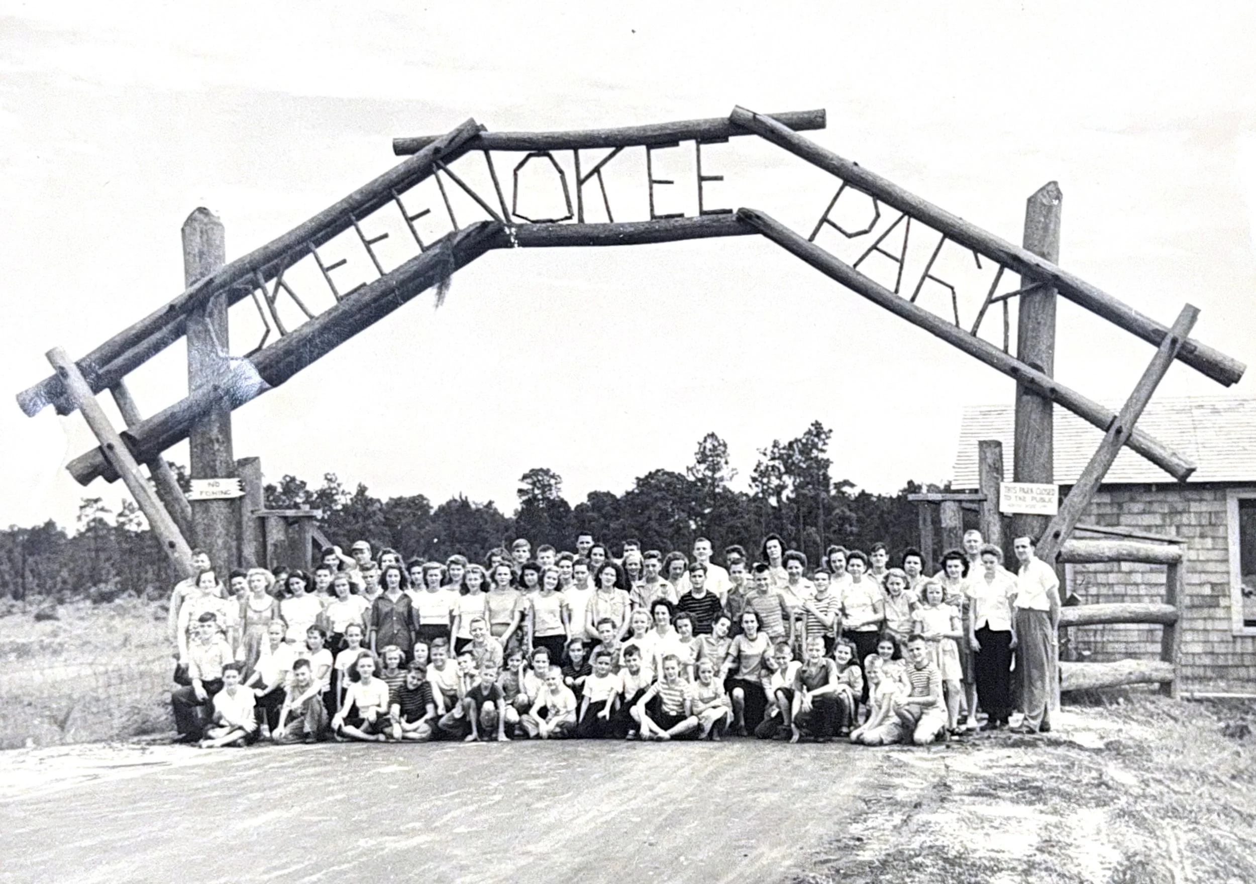 A black and white historical photo depicting a group of students at Okefenokee Park