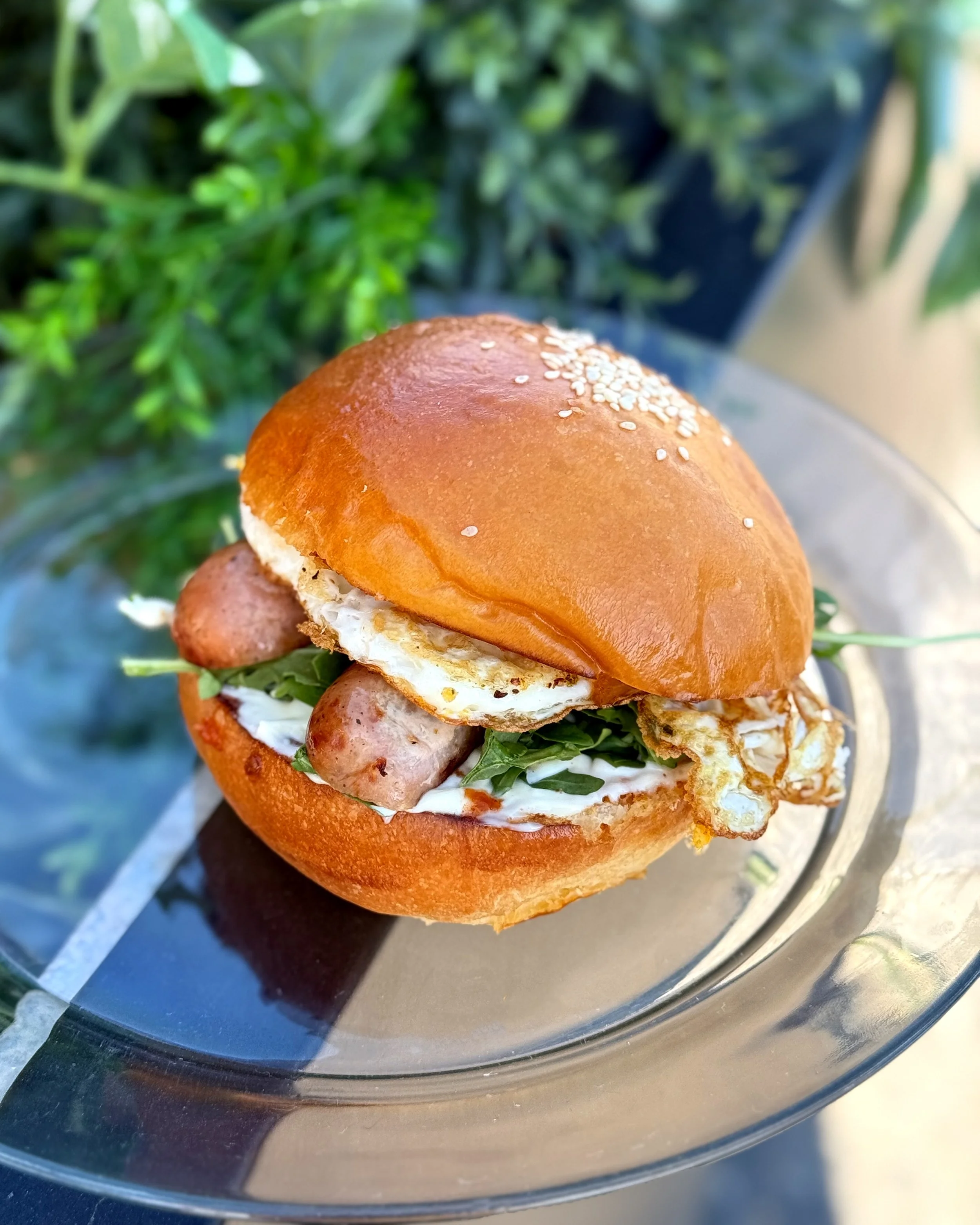 Chicken and apple sausage breakfast sandwich on brioche