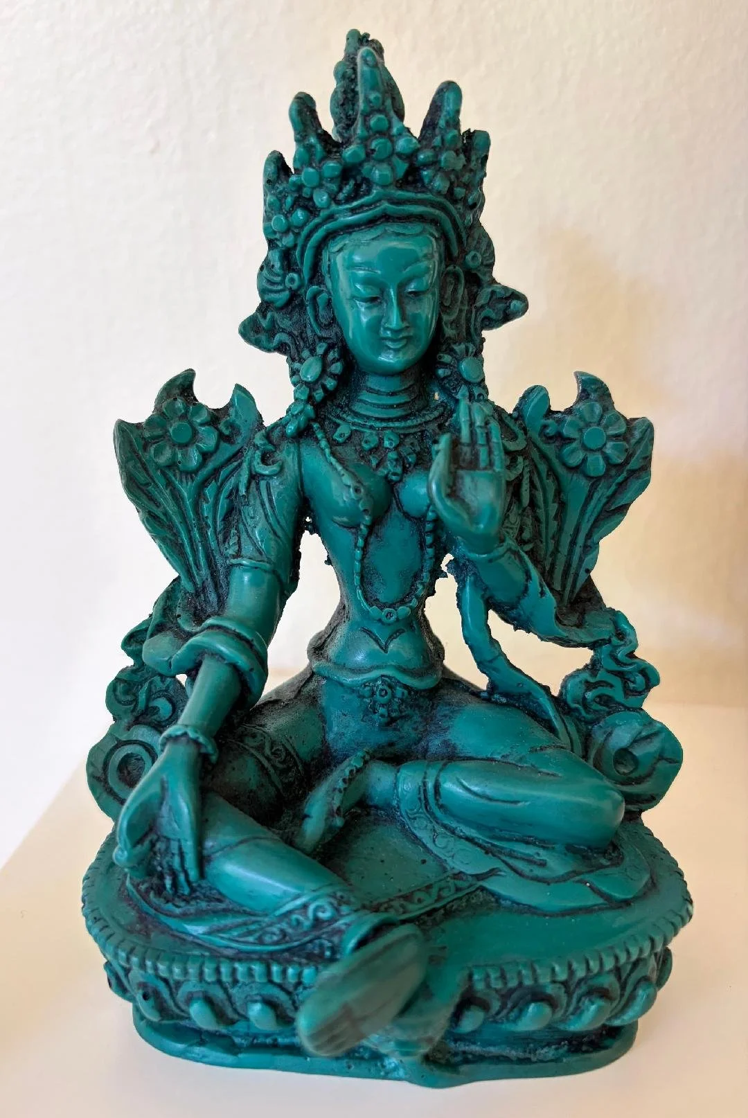 Statue of Green Tara, embodying active compassion and protection.