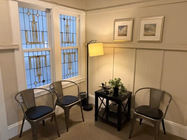 Softly lit waiting room  with natural light and plants in Presidio Heights office