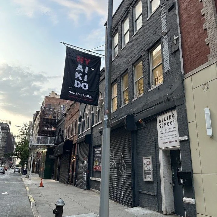 We can't wait to welcome you back with...a new banner! Early this morning it got delivered and hung with a very big crane. The old one was holding on by a literal thread, so it was time. Just in time to greet Osawa Sensei and all of us back on Saturd