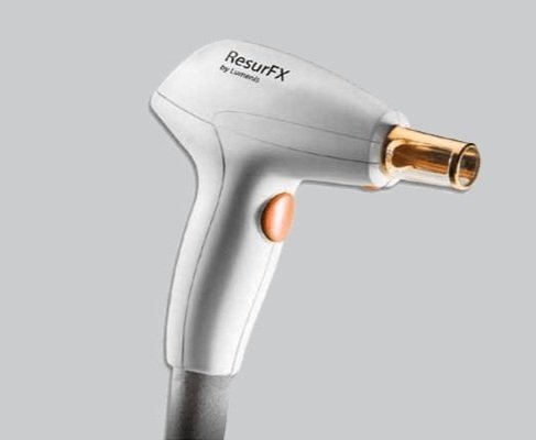 A ResurfX laser skin treatment device with a white body and a gold-tipped nozzle.