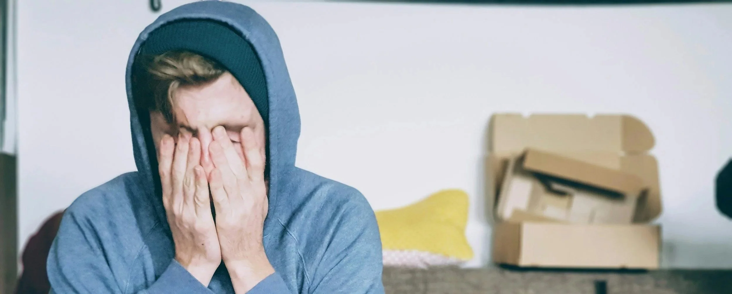 Overwhelmed teenager studying while experiencing chronic stress and emotional exhaustion