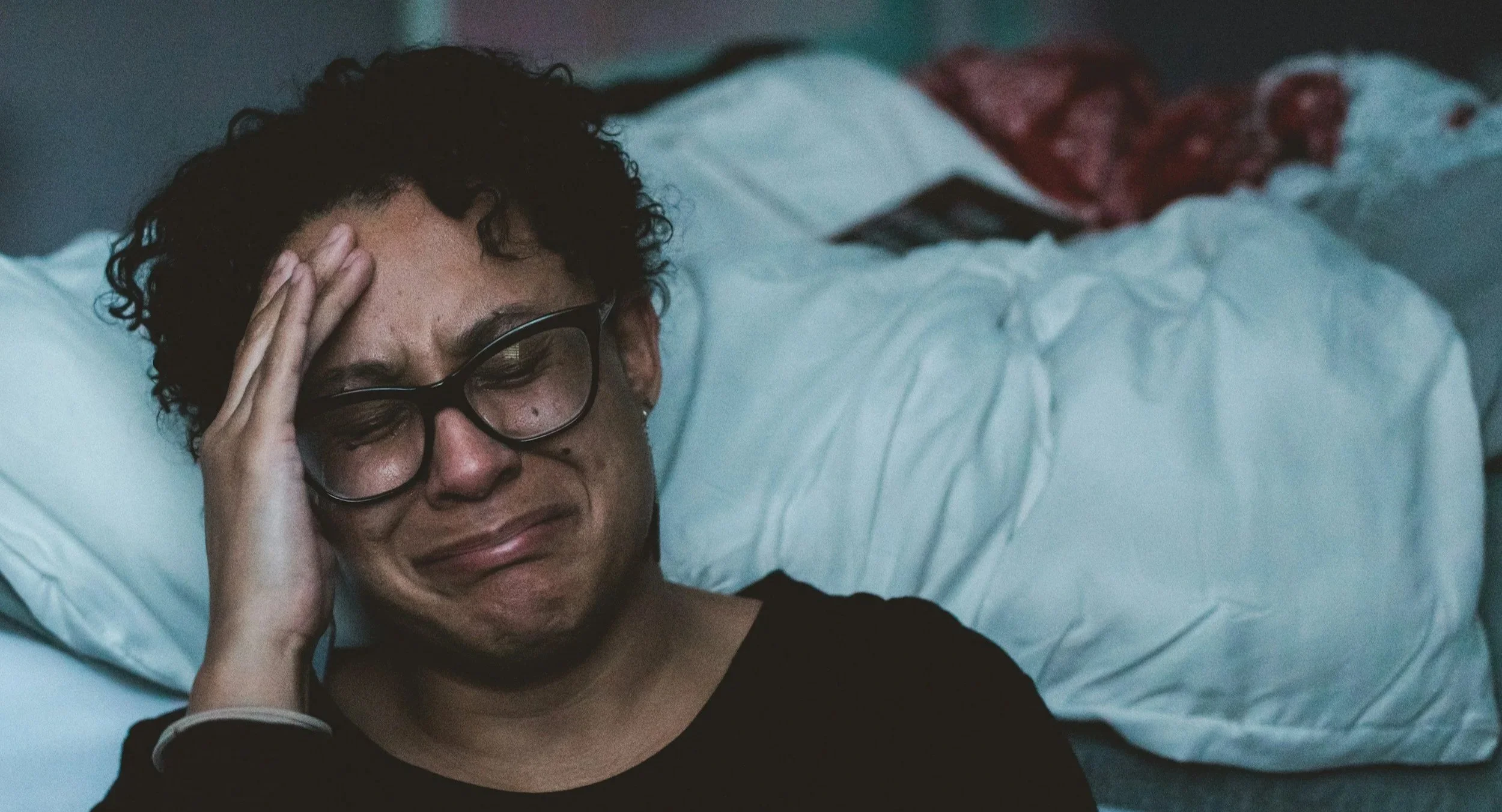 Adult experiencing emotional overwhelm and nervous system overload from chronic stress and trauma