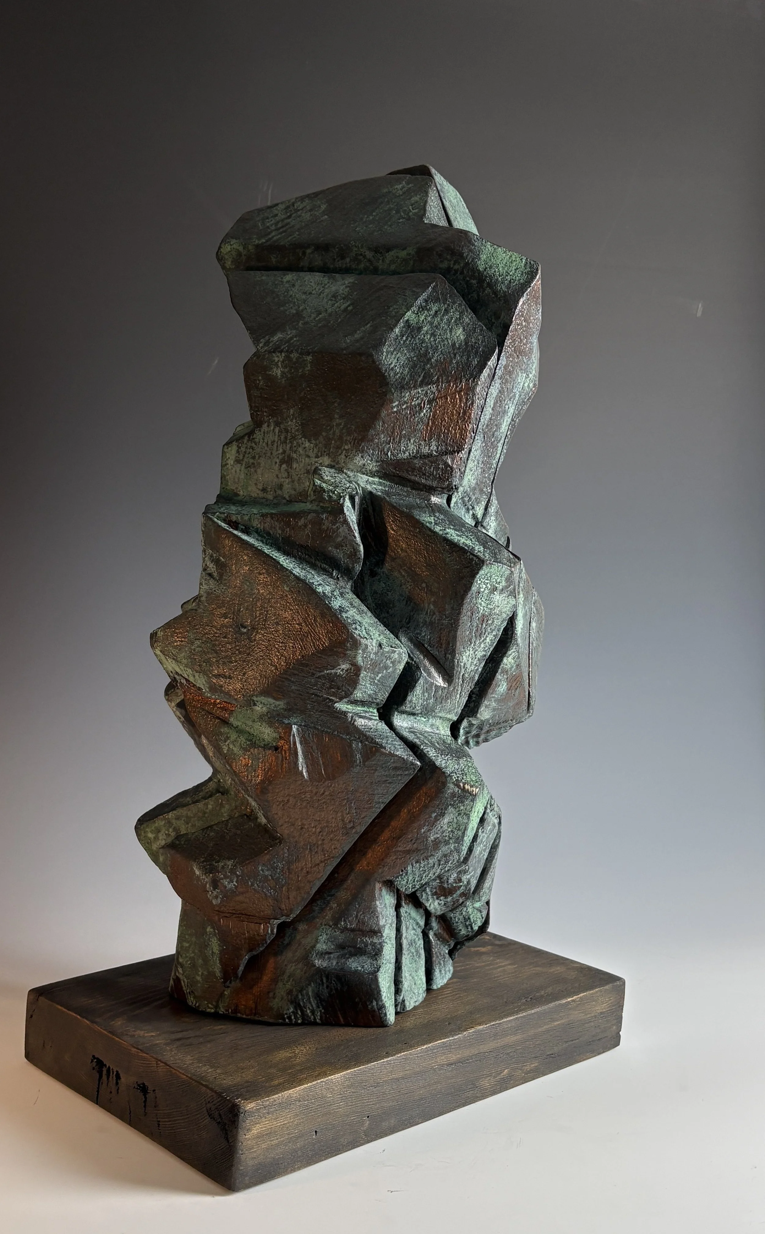 Solara, 2026.  Mixed wood species, bronze coating, 23 x 13 in.
