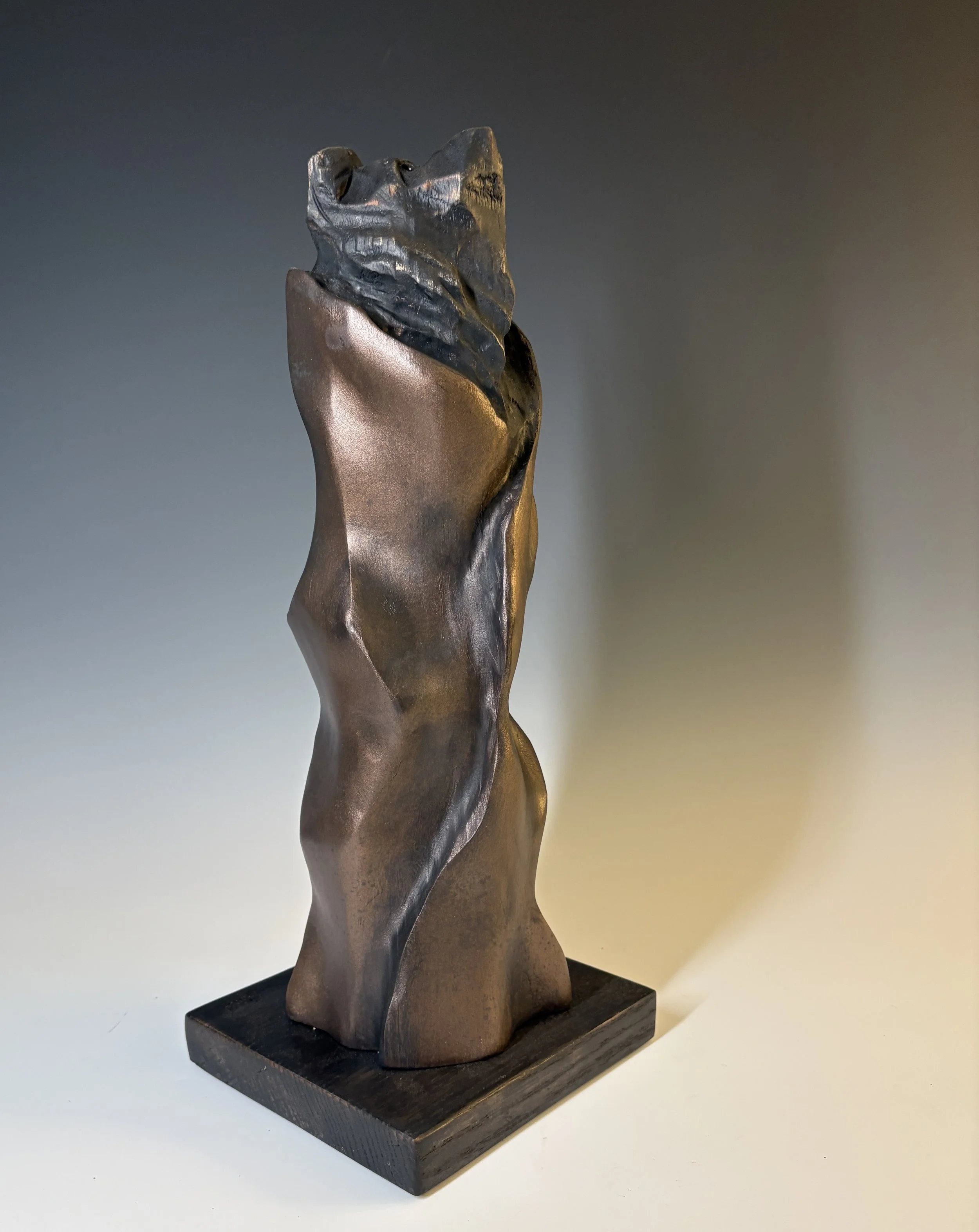 Tall Bear in Long Robe, 2025. White Pine, bronze coating — 18 x 7 in, private collection.