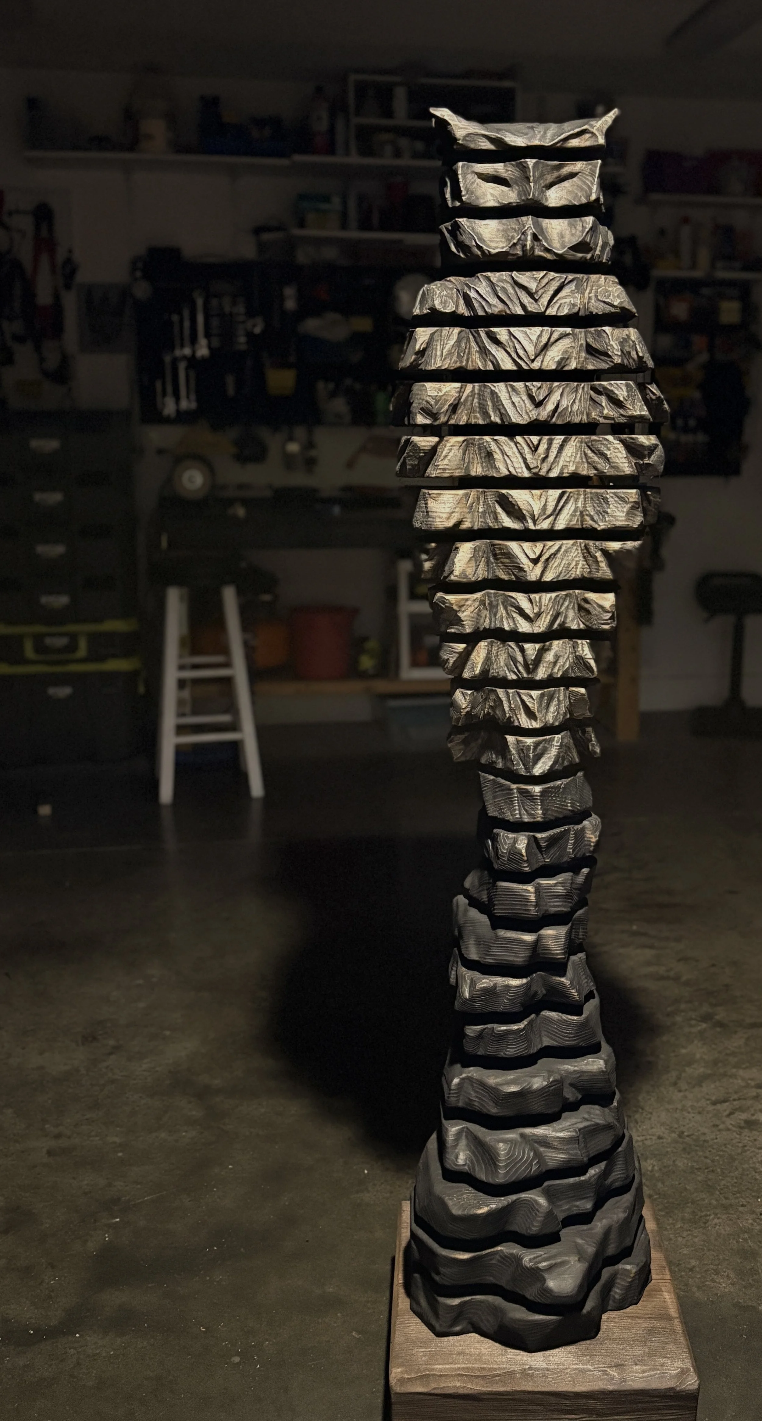 Sentinel's Fire (Sentinel X), 2025.  White Pine, graphite — 64 x 15 in. Private Collection