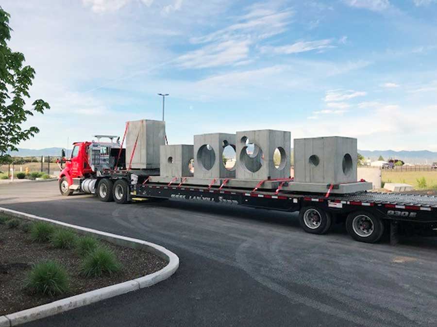 Custom-precast-concrete-products-on-truck-shipping-out-from-Rogue-Valley-Precast.jpg