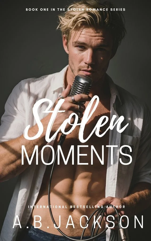 Book cover of "Stolen Moments" by A.B. Jackson. Developmental and line editing services provided by Dakota for this MM romance novel.