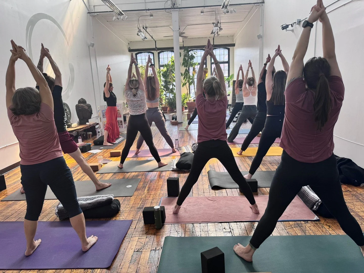 Whenever you work in one direction in a posture, there is always an opposite energy flow.  As you move down and get grounded through the feet, the pelvis and the hips, lengthen up through the side waist and let the arms stretch vigorously up.