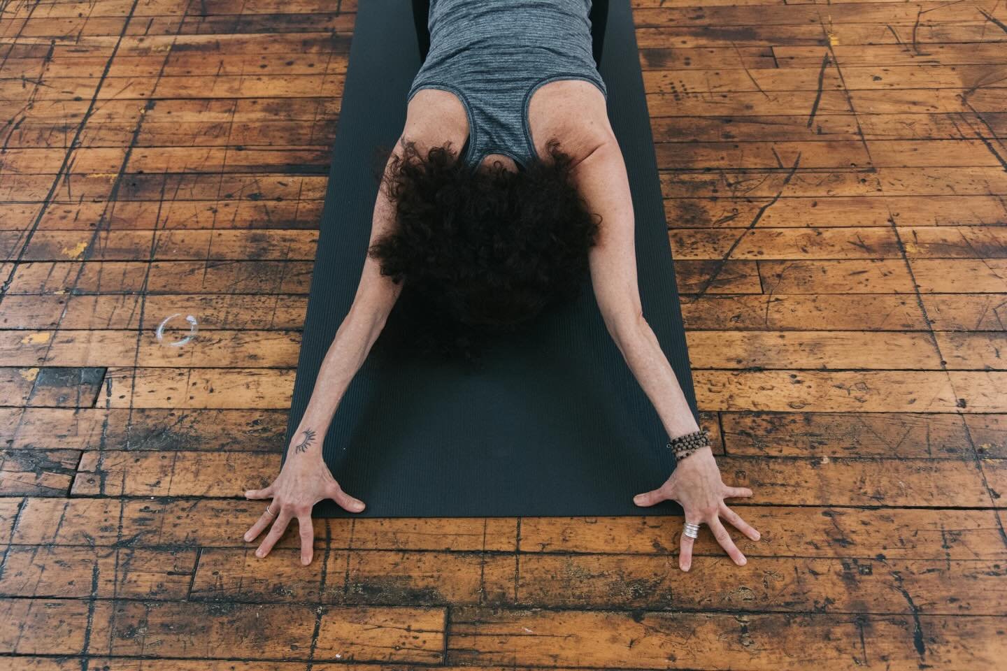 Anahatasana. From tabletop, walk hands forward. Forehead (or chin) to the mat. Chest melts toward the floor. Find some engagement in your hands. Pay some attention to your breath.

This posture invites opening in the chest, shoulders, and upper back.