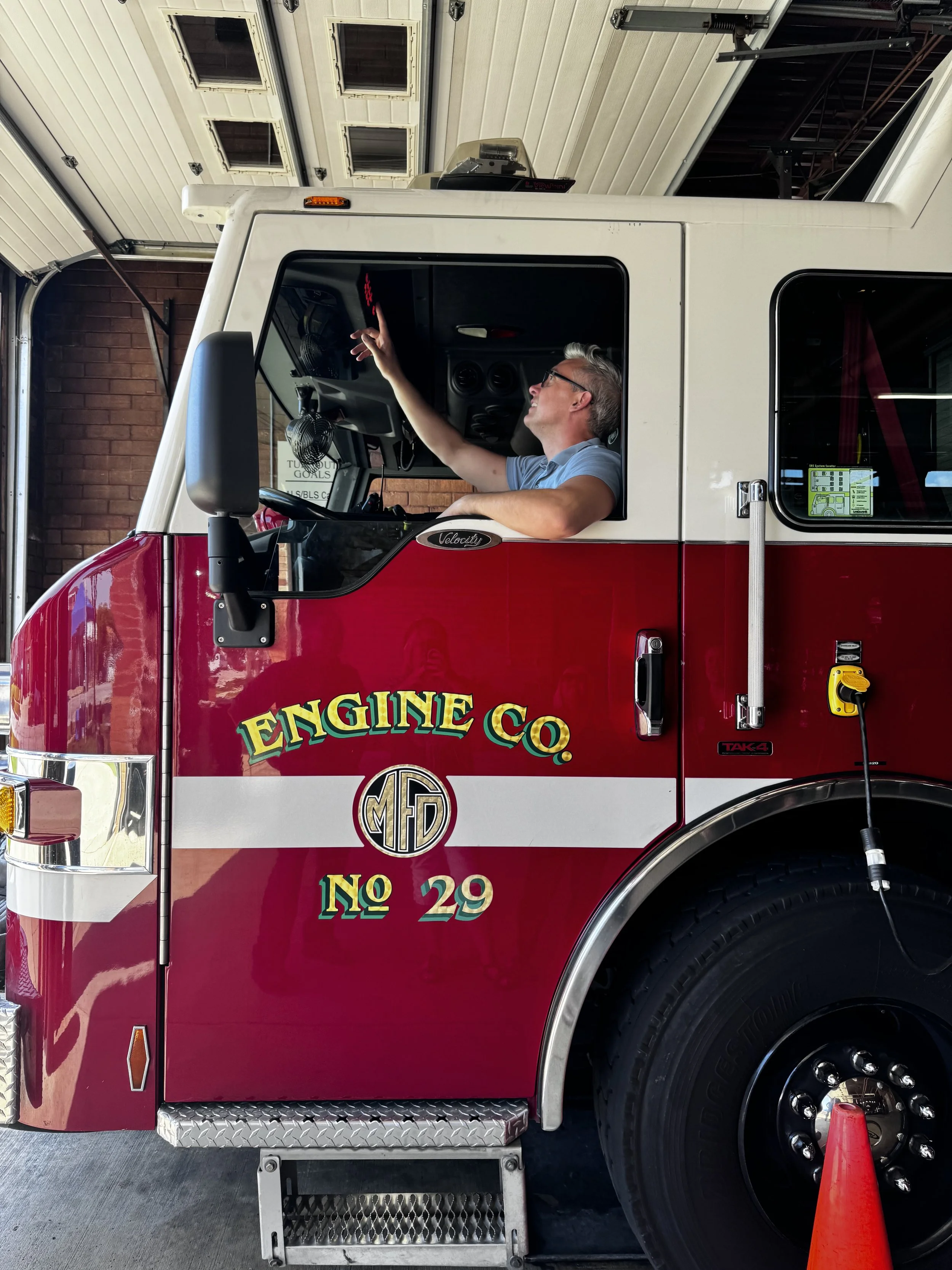 Alderman Peter Burgelis in a firetruck
