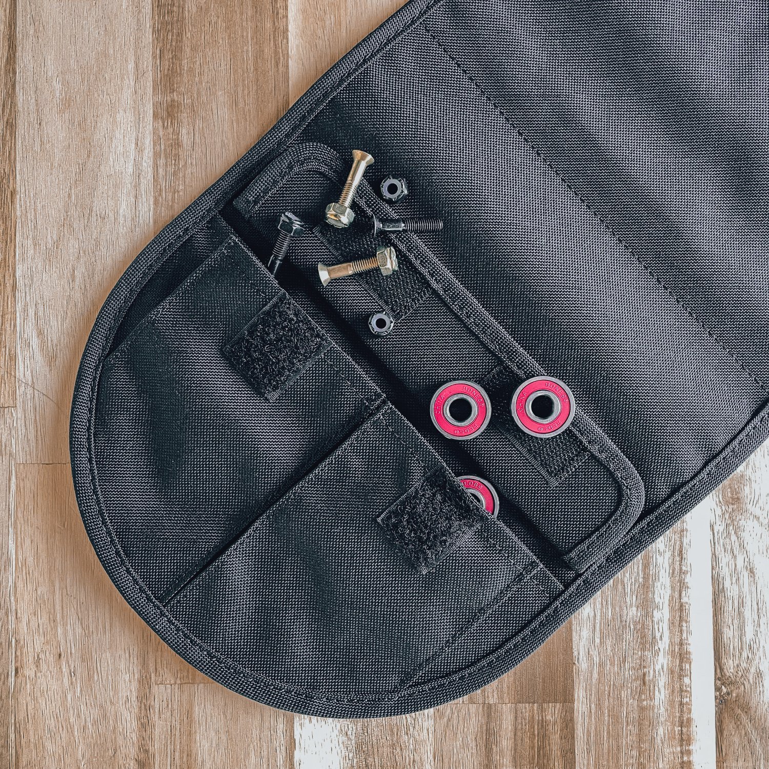 Hang tight to your skateboard with the Parking Block Skateboard Door Hanger, which has mini pockets to store smaller hardware.