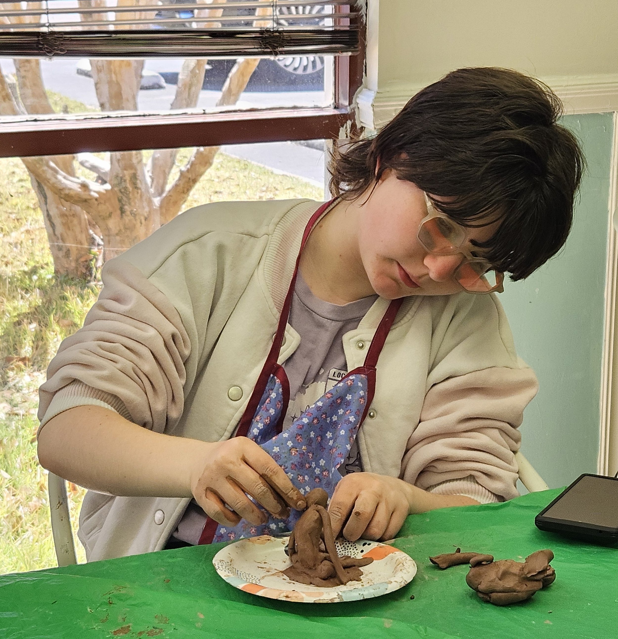 Teen sculpting clay.jpg