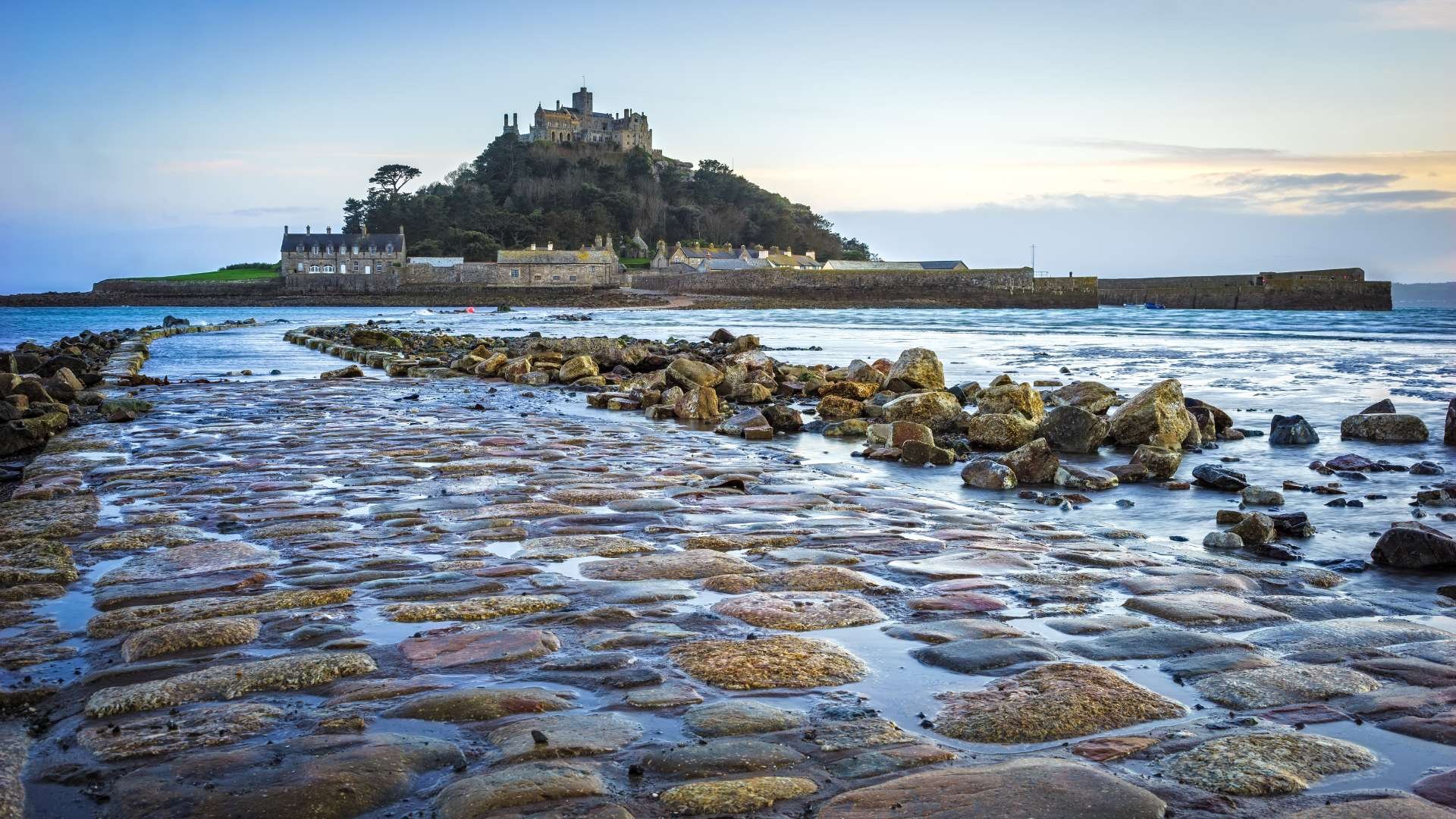 St Michael’s Mount: "Historic castle atop St Michael’s Mount island during low tide in Cornwall."