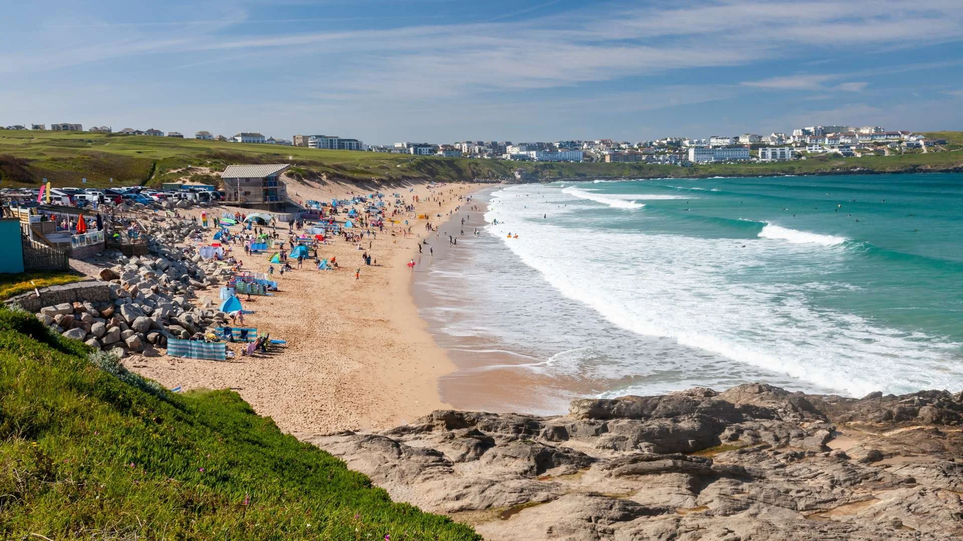 Surfing on the North Cornish Coast: "Surfers catching waves at Fistral Beach, Newquay, the heart of British surfing."