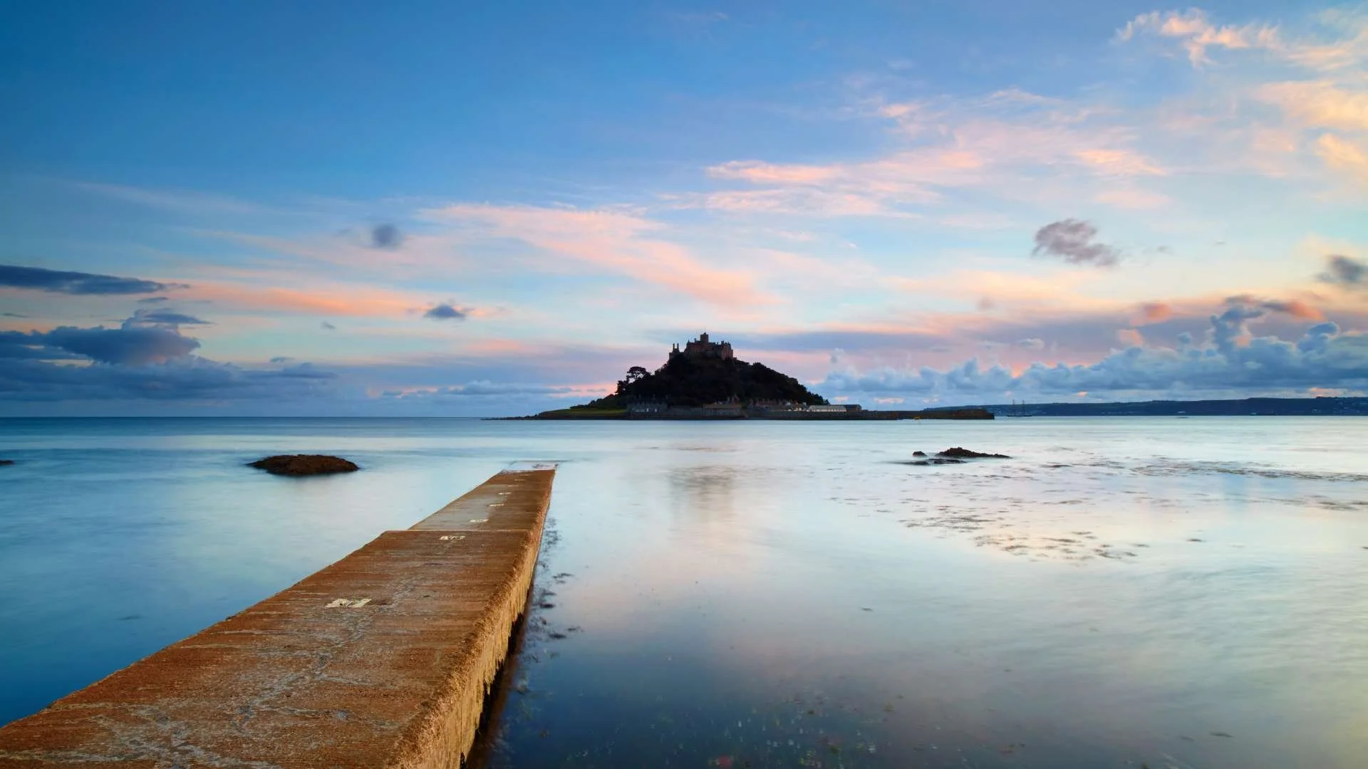 St Michael’s Mount: "Historic castle atop St Michael’s Mount island during low tide in Cornwall."