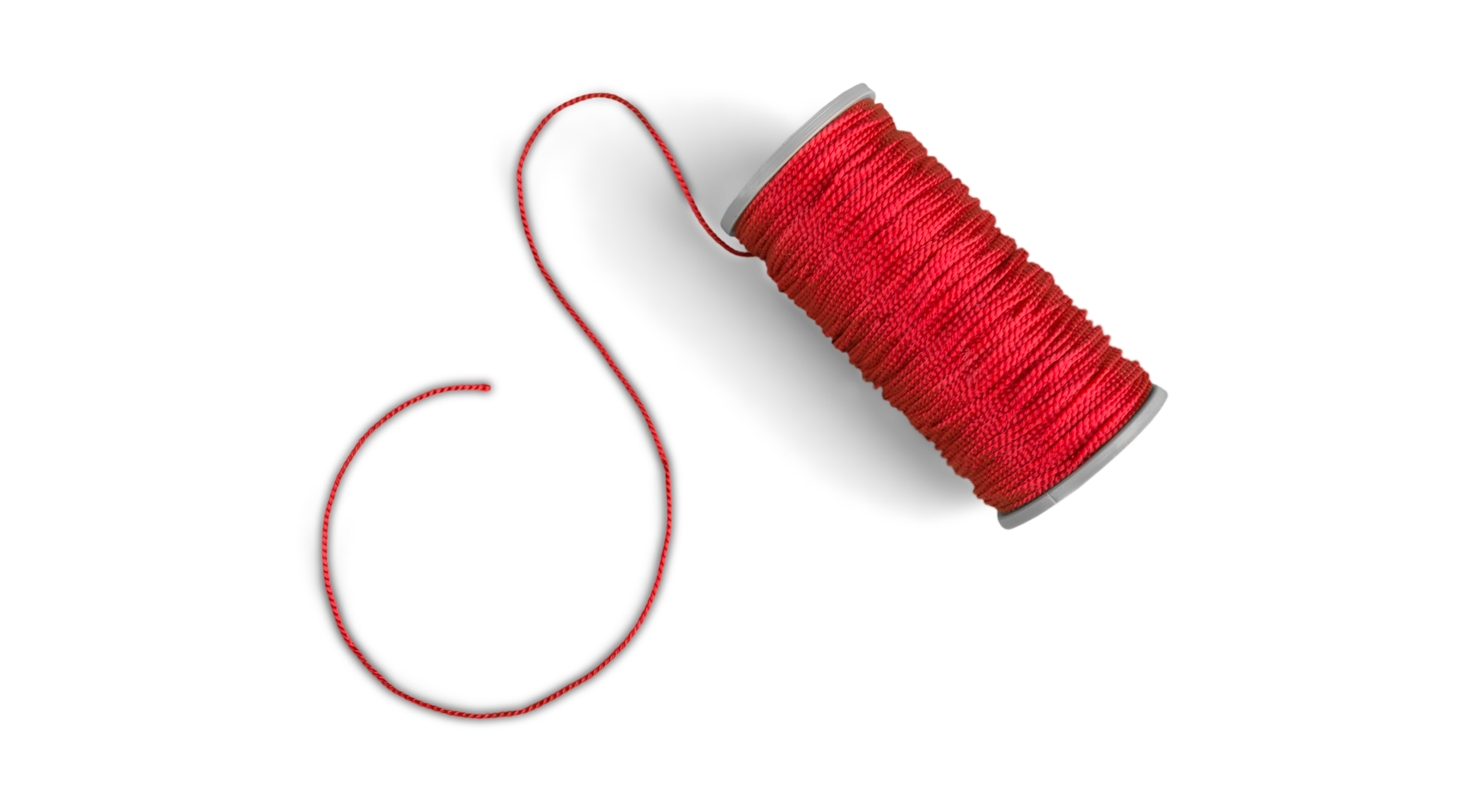 Image of a spool of red thread with a loose end curling around, against a black background.