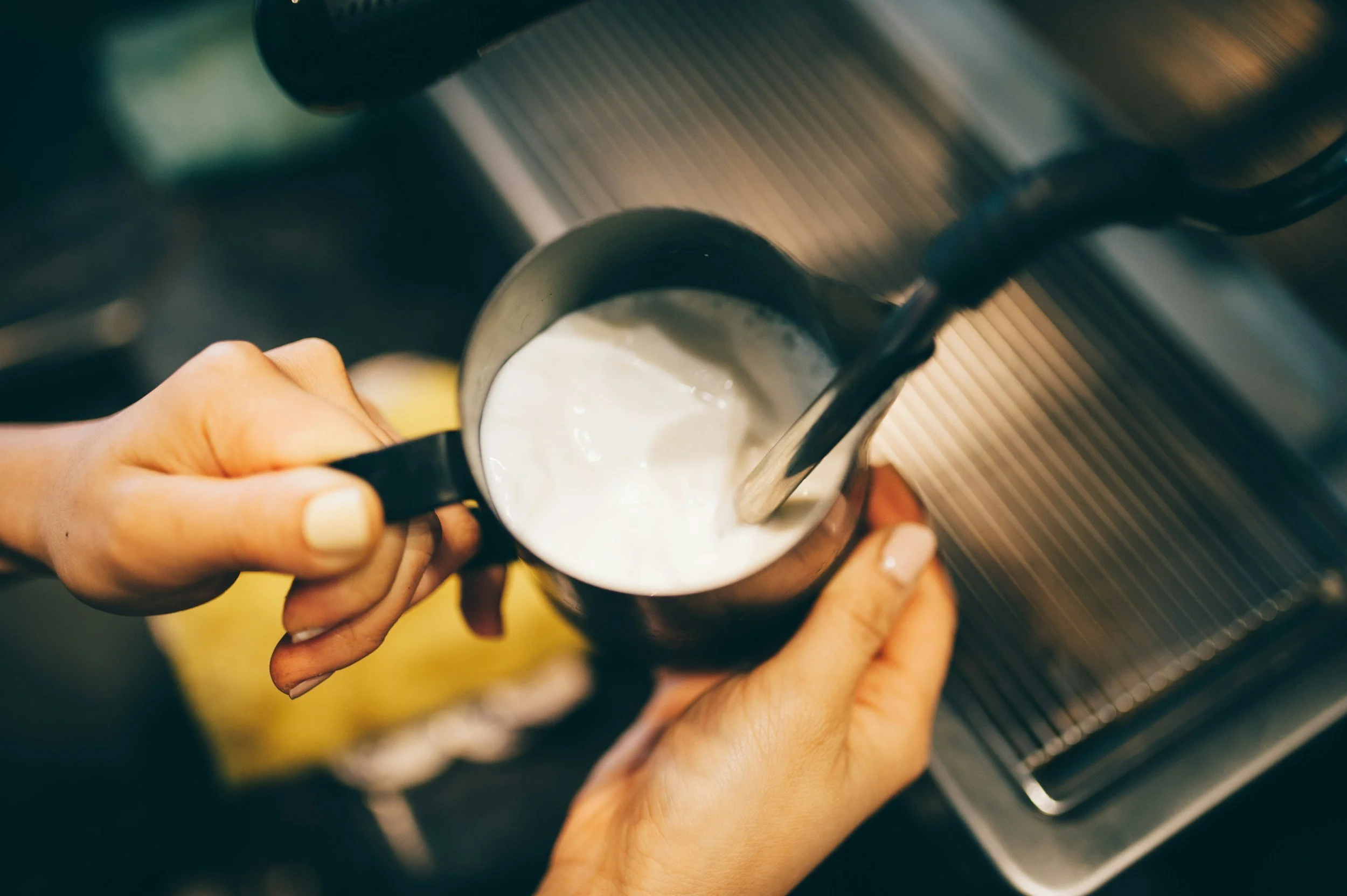 Barista steaming alternative milk