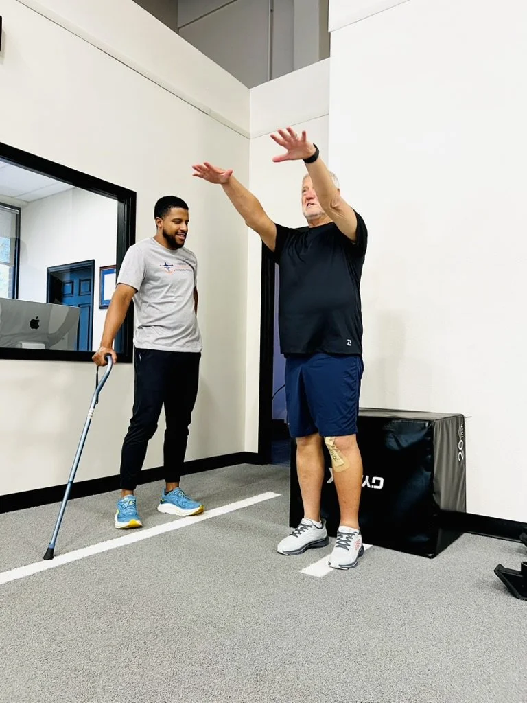 Dr. JJ Martinez working with a patient