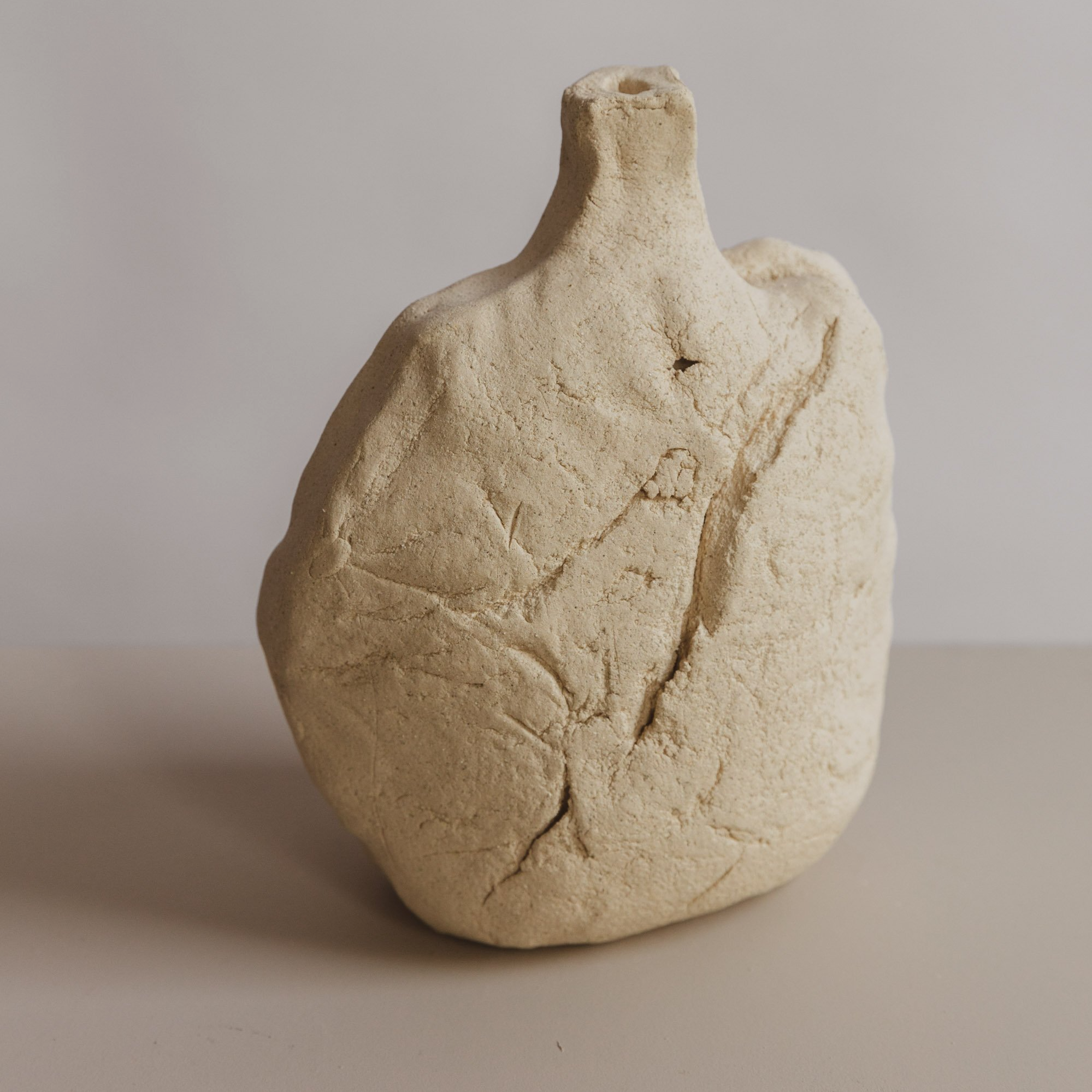 #39 Sculptural bottle No. 7, 2025, 7.5"H x 6.5"L x 3.5"W, sculpture clay.