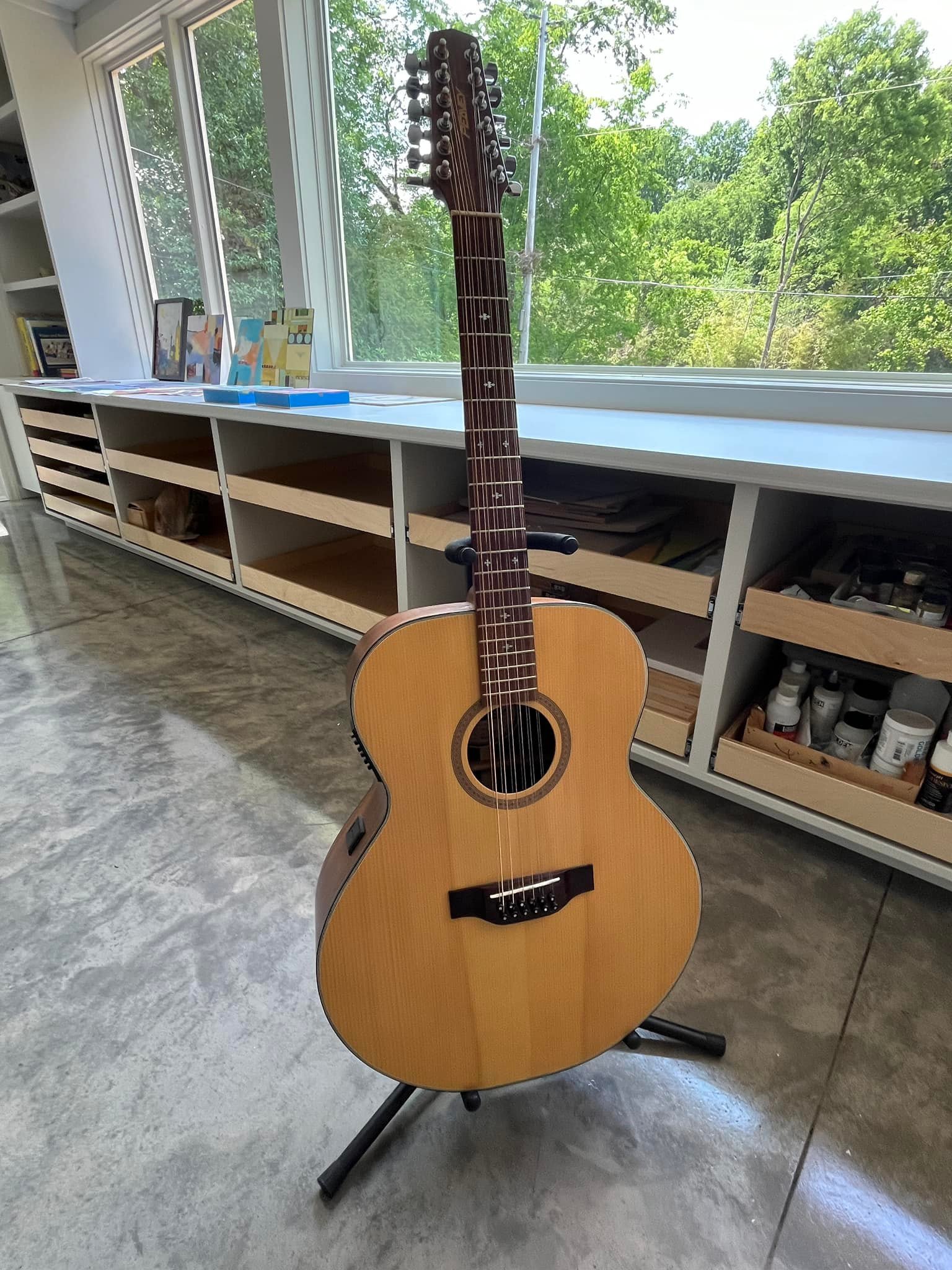 Charlotte -and area- folks / I have a 12-string electric-acoustic guitar in pristine condition ..
comes with a great Epiphone hardshell case. The guitar is a1994 Peavey CJ33-12.  Made in Finland actually.. Peavey had a luthier company there make high