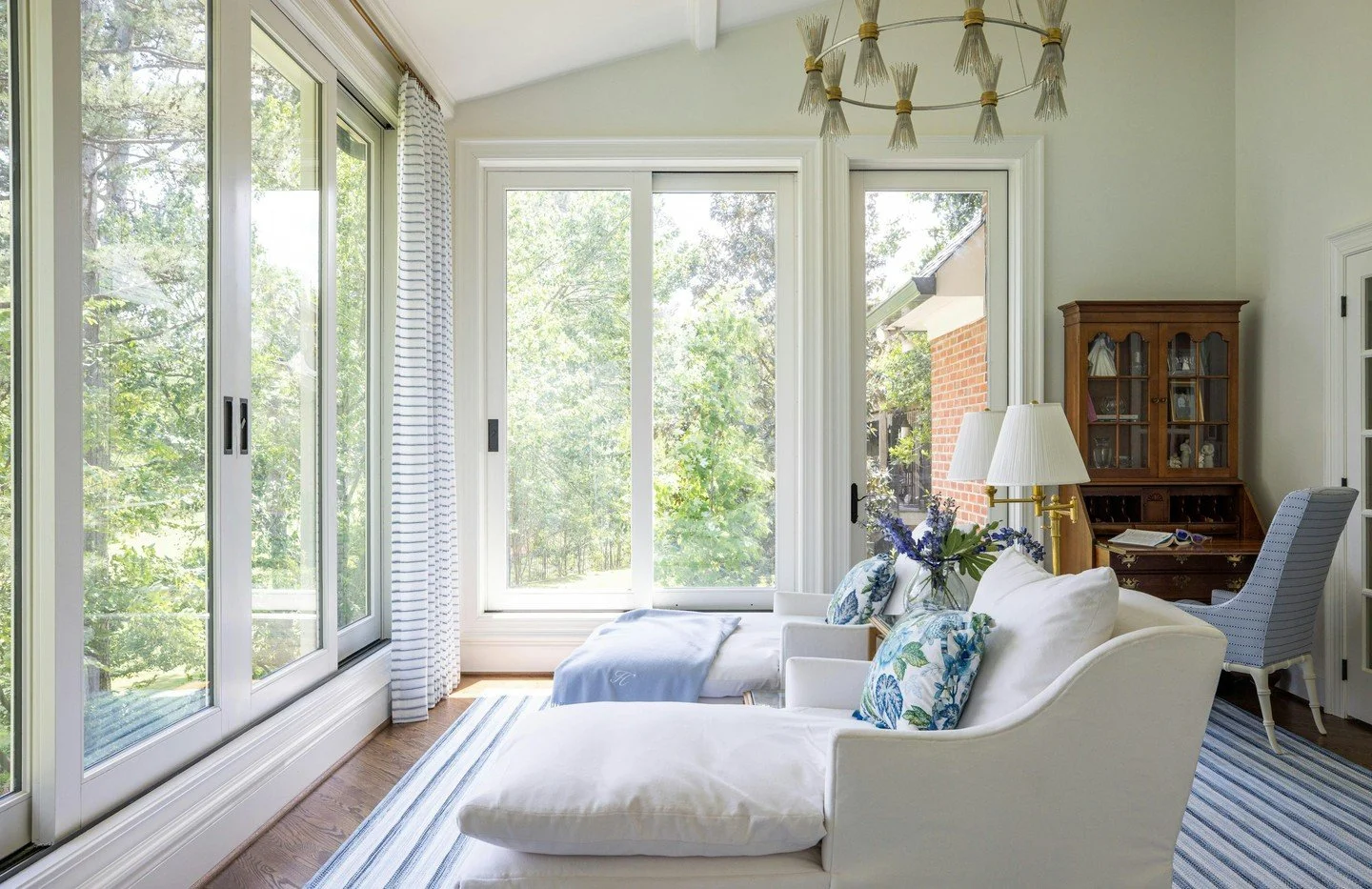 Floor-to-ceiling windows frame the garden and golf course views in this serene reading nook.

#LuxuryInteriors #InteriorDesign #BedroomDesign #SereneSpaces #DesignInspiration #DreamHome #CarolineBrackettDesign