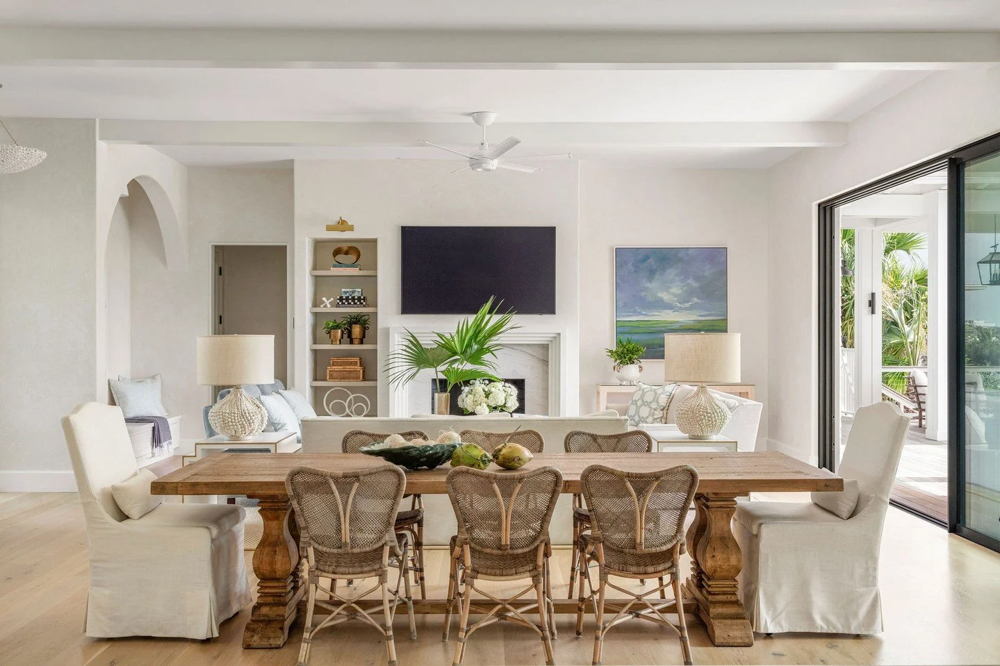 Sunlight pours in from the oceanfront patio, welcoming guests to settle in around the dining table. 

Architecture: @herlongarchitects
Builder: @phillip_smith_contractor
Photographer: @julialynnphotography

#CoastalLuxuryDesign #ModernCoastalArchitec