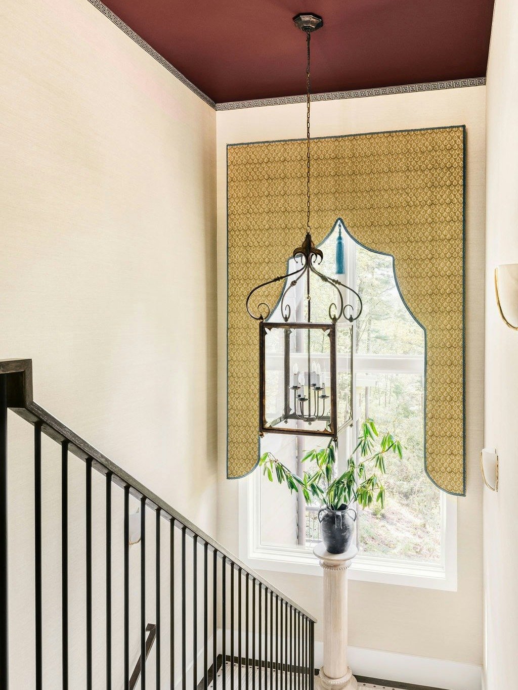 Elevating the journey from floor to floor. A striking custom lambrequin frames the mountain view, while an antique iron lantern anchors the space against that bold, moody ceiling. Who else is obsessed with this color palette? ✨

#LuxuryInteriorDesign
