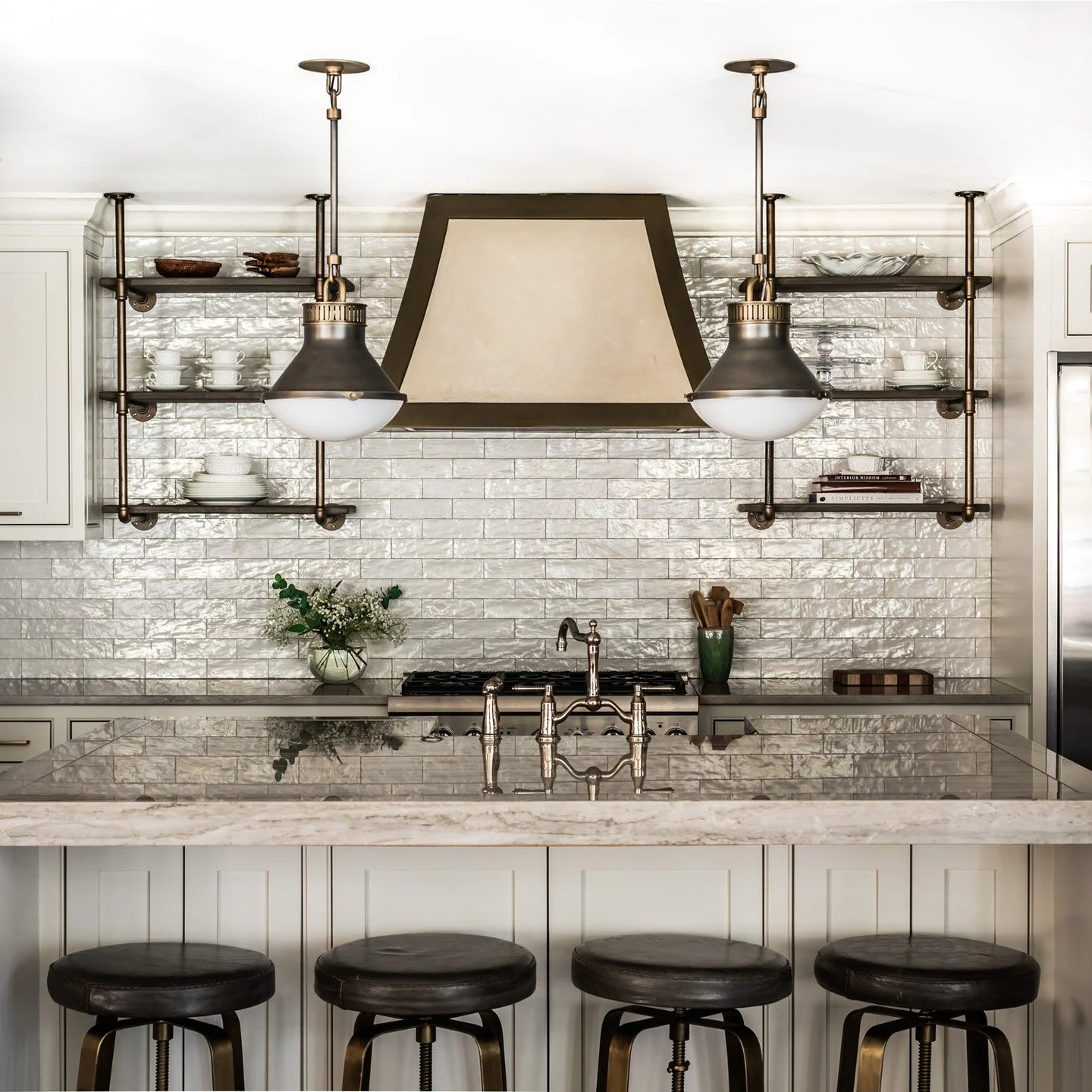 A stunning space to reflect on your day (pun intended). 

Lighting: @urbanelectricco
Range Hood: @francois.and.co

#LuxuryKitchenDesign #InteriorDesign #KitchenDesign #ReflectiveTile #DesignInspiration #TimelessInteriors #CarolineBrackettDesign #Cust