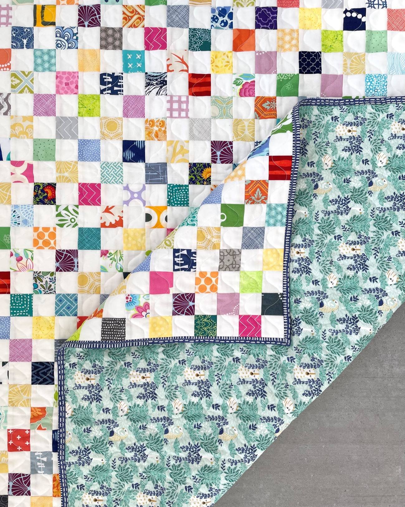 Small scrappy quilt with front and back detail
