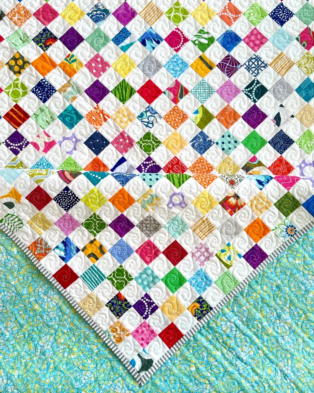 Large scrappy quilt with front and back detail